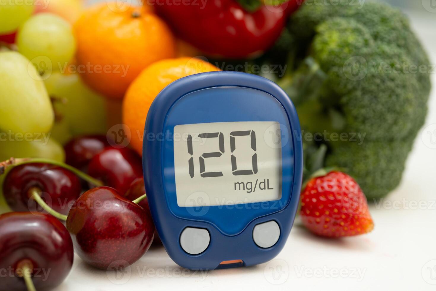 Glucose meter with vegetable and fruit for check sample blood photo