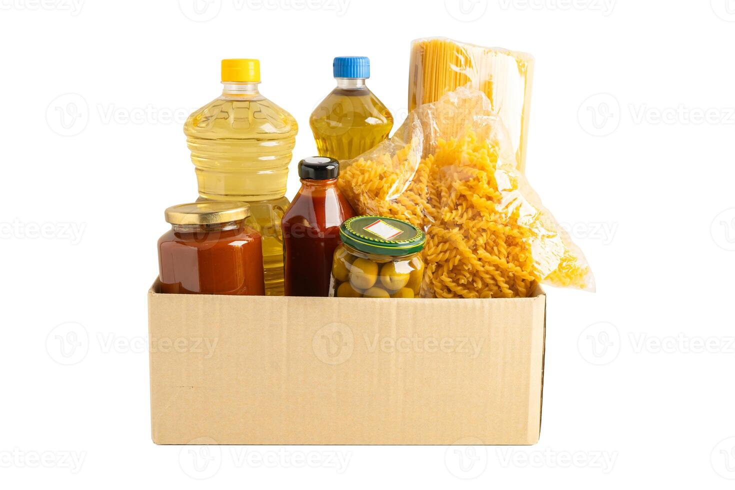 Foodstuffs in donation box isolated on white background with clipping path for volunteer photo