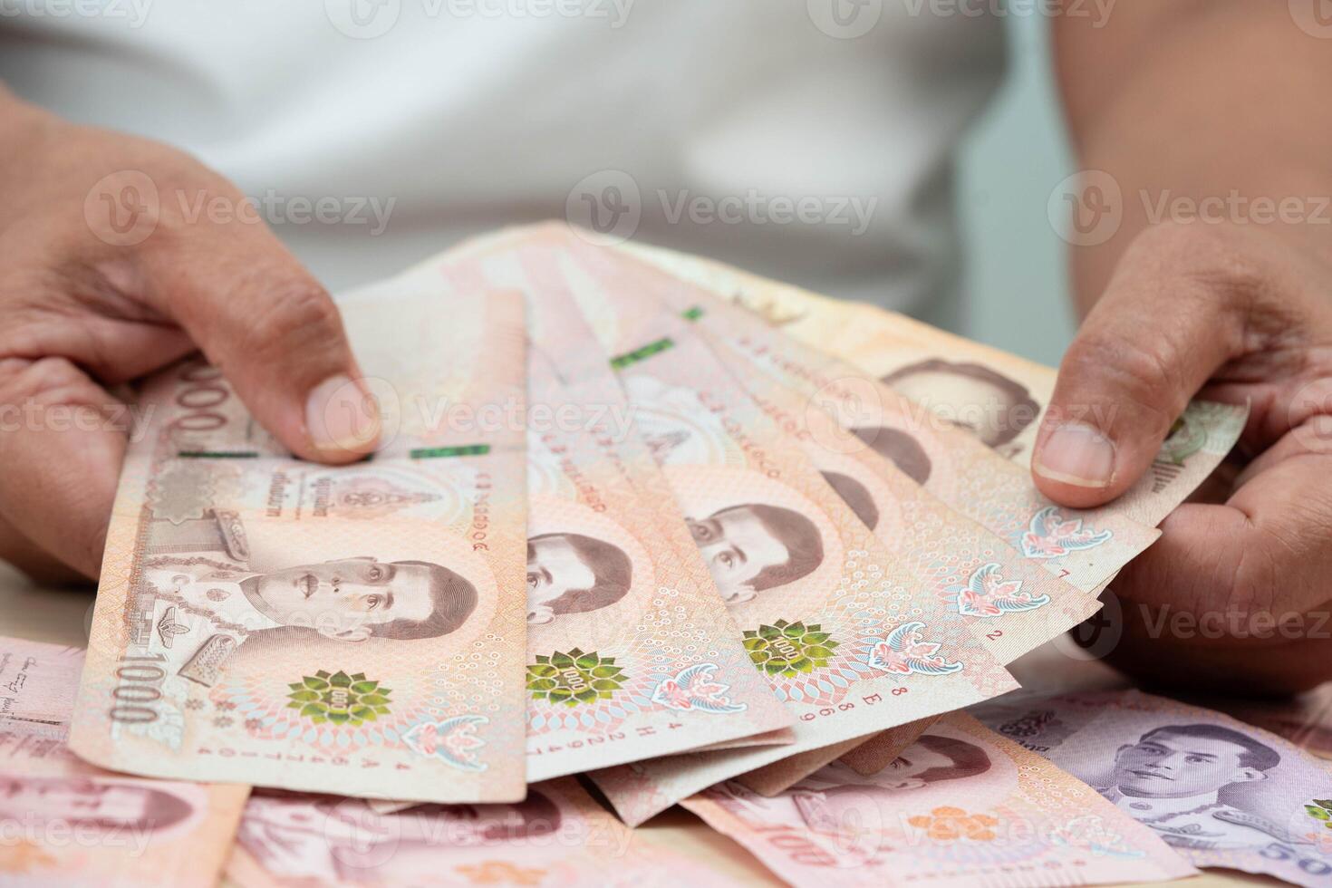 Asian woman counting Thai baht banknote money, investment economy, accounting business and photo