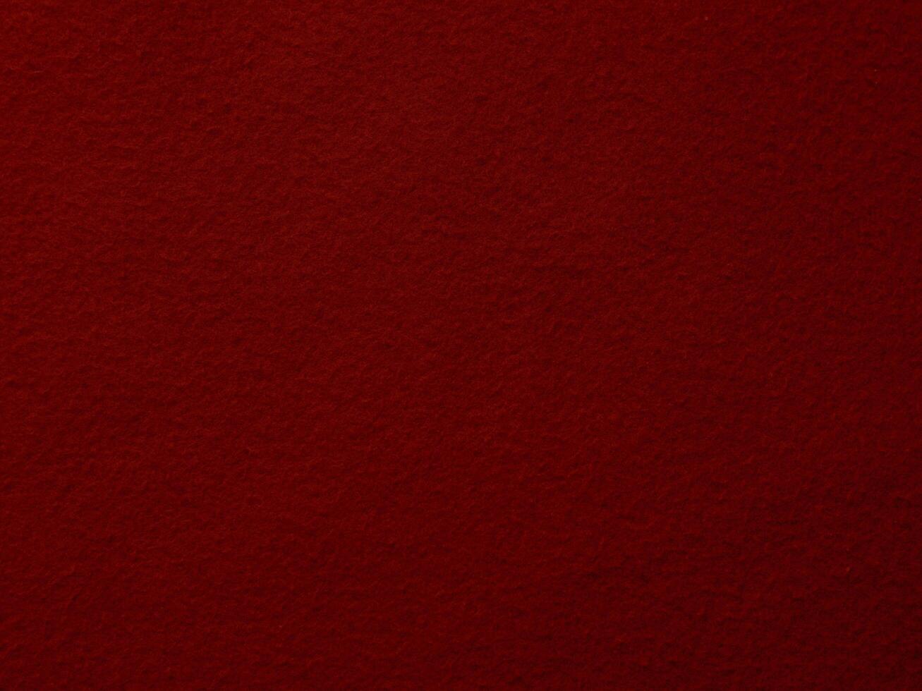 A close up of a red fabric with a rough texture photo