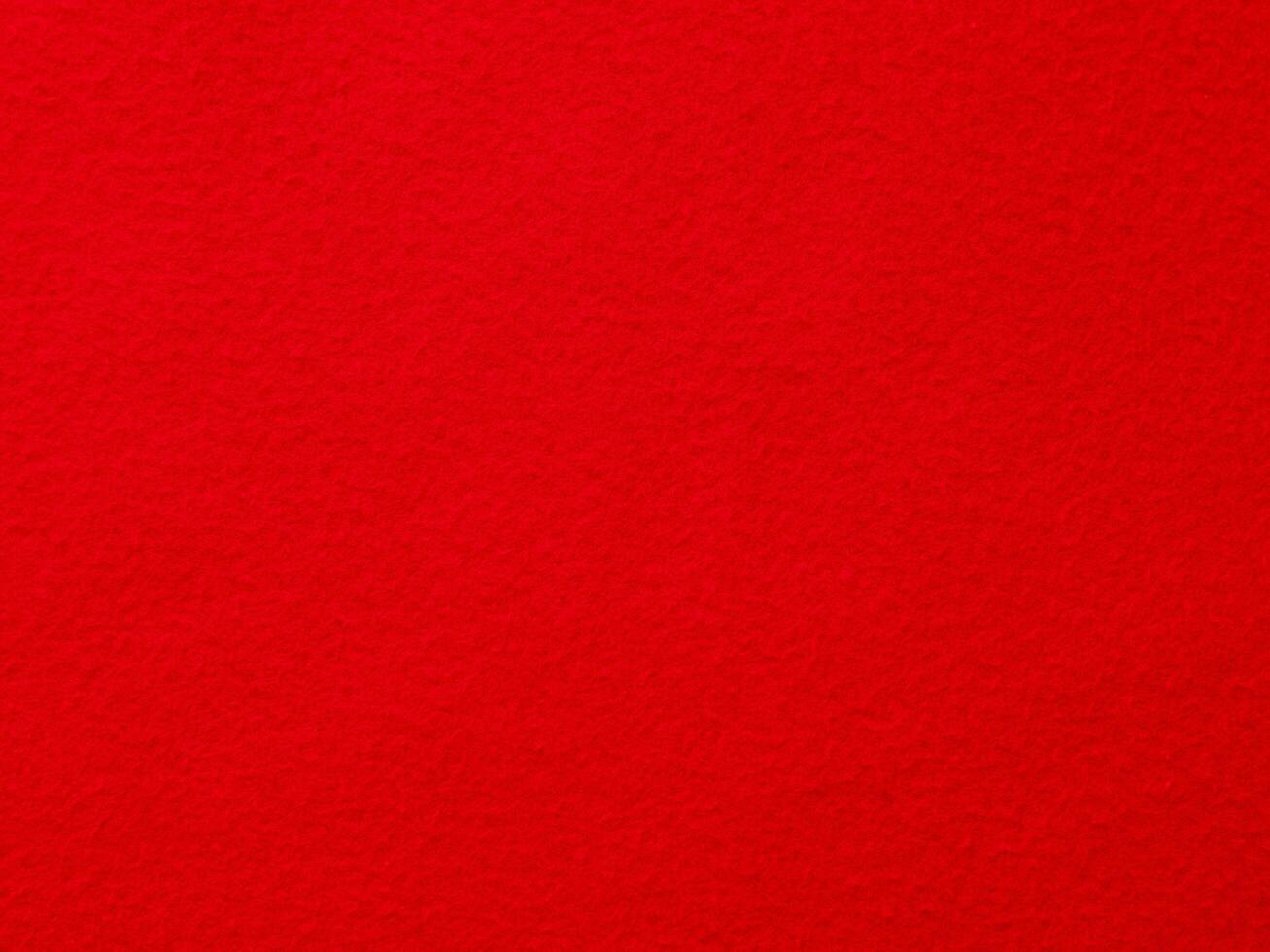 A red background with a red object in the foreground photo