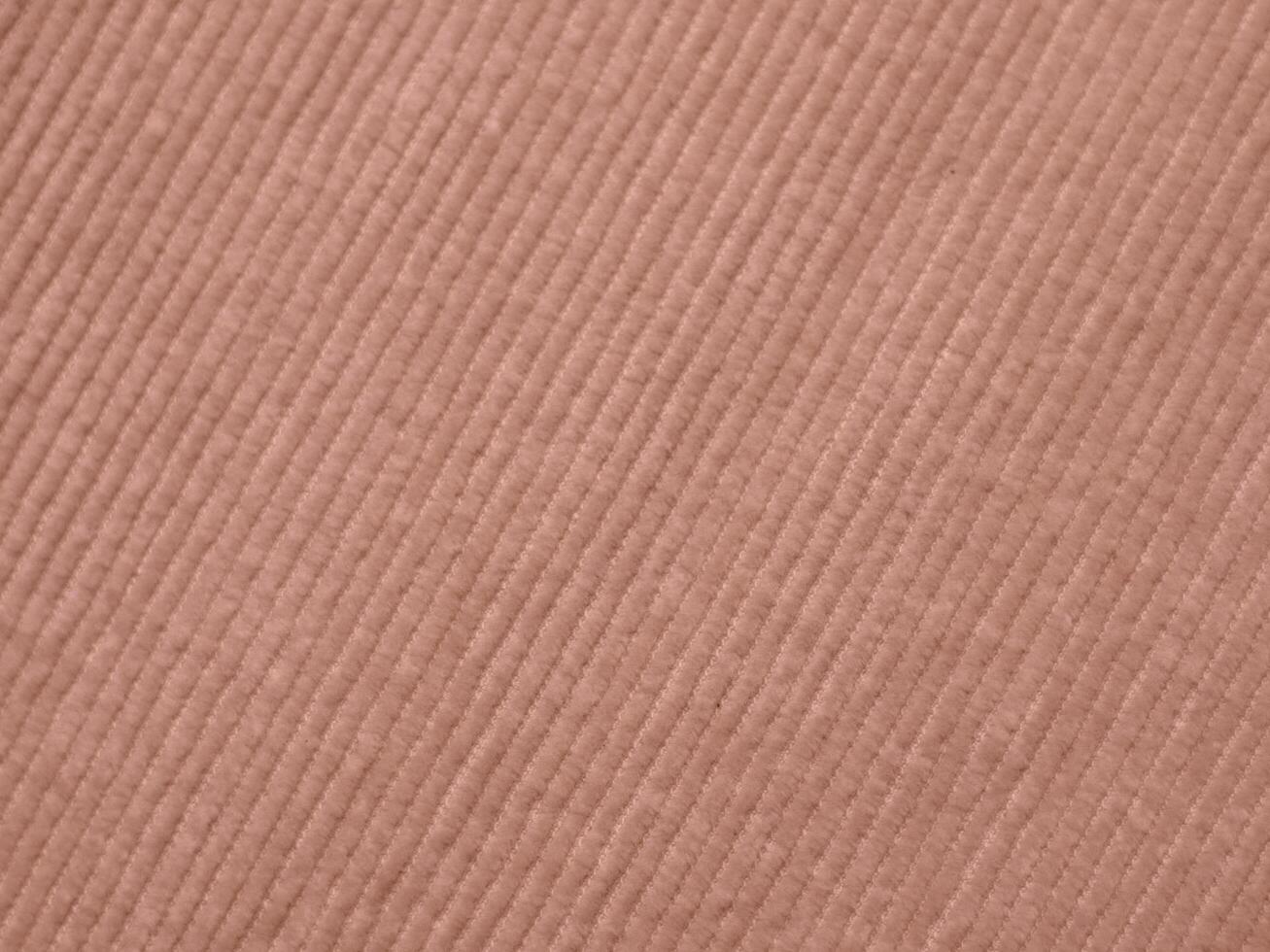 A pink fabric with a striped pattern photo