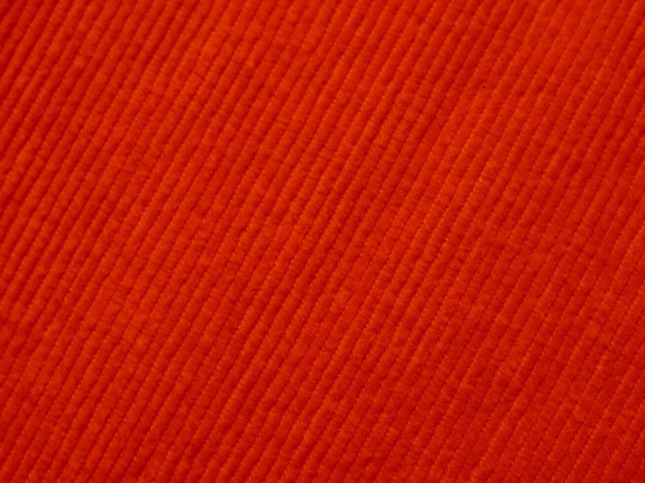 A red fabric with a striped pattern photo