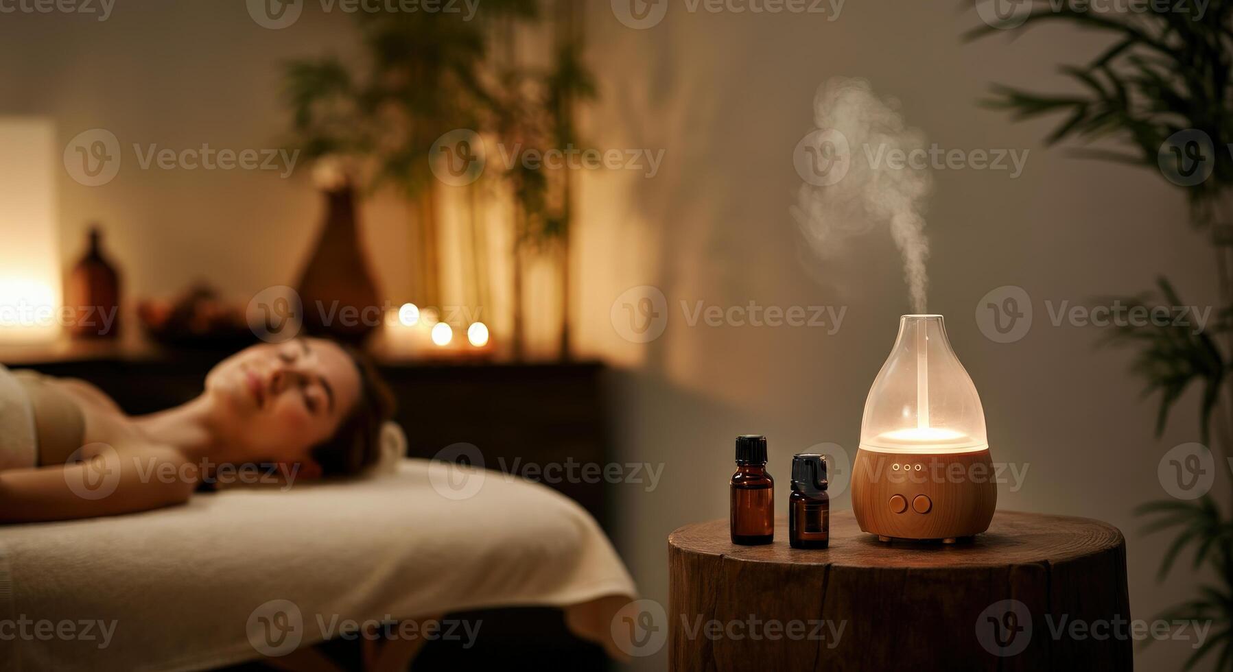 Tranquil spa ambience with aromatherapy diffuser and relaxing candlelight setting photo