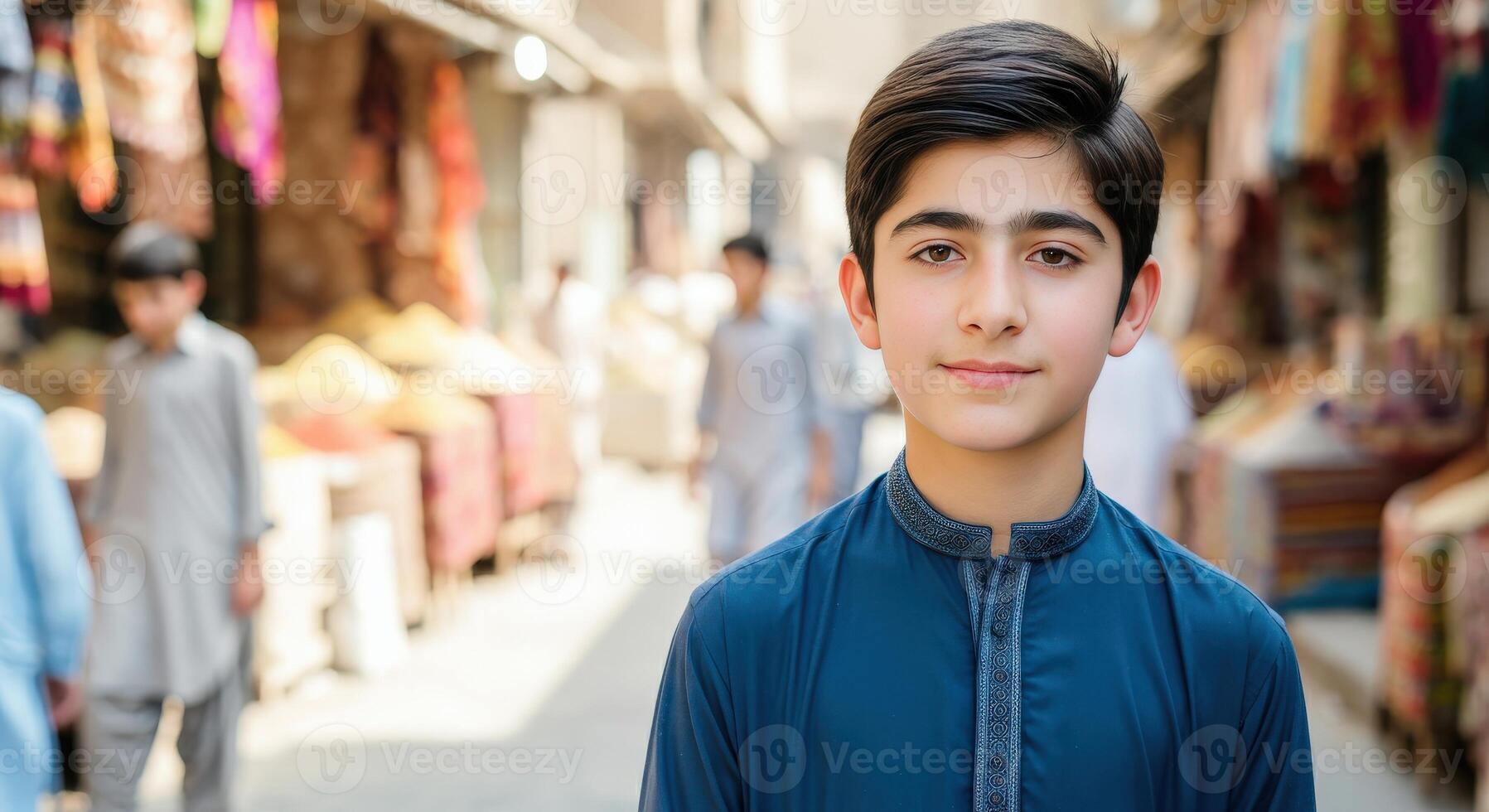 Young middle eastern boy in traditional attire at bustling marketplace photo