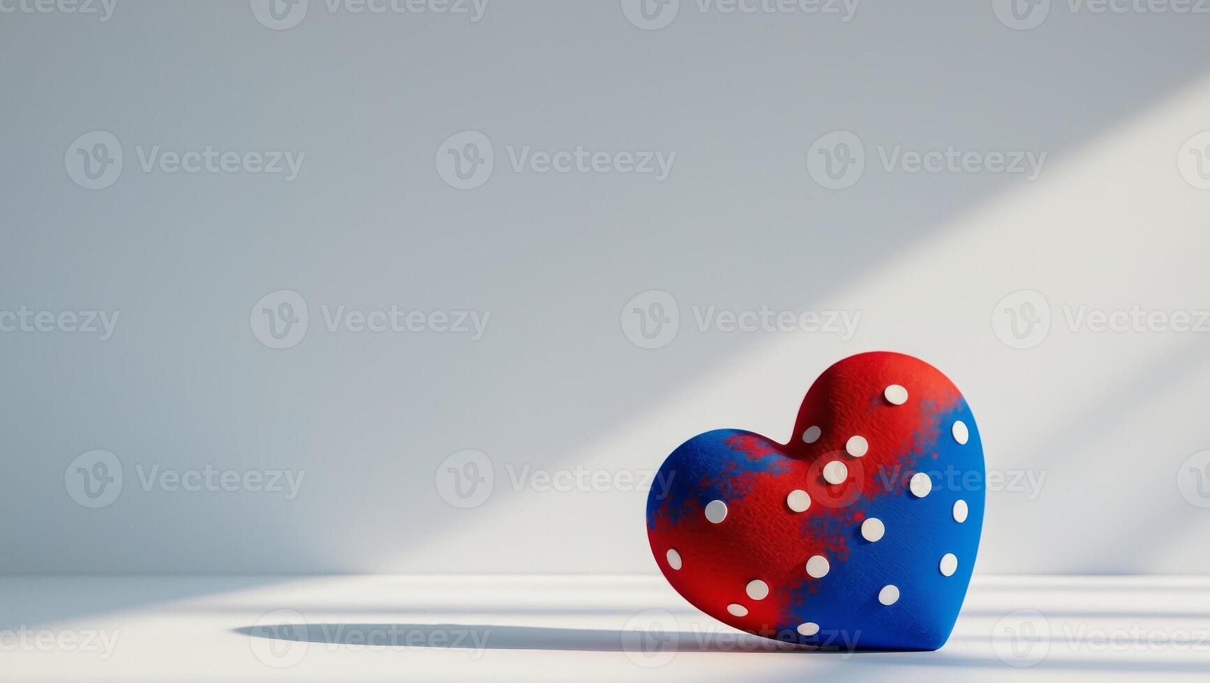 A blue and red heart decorated with white polka dots photo