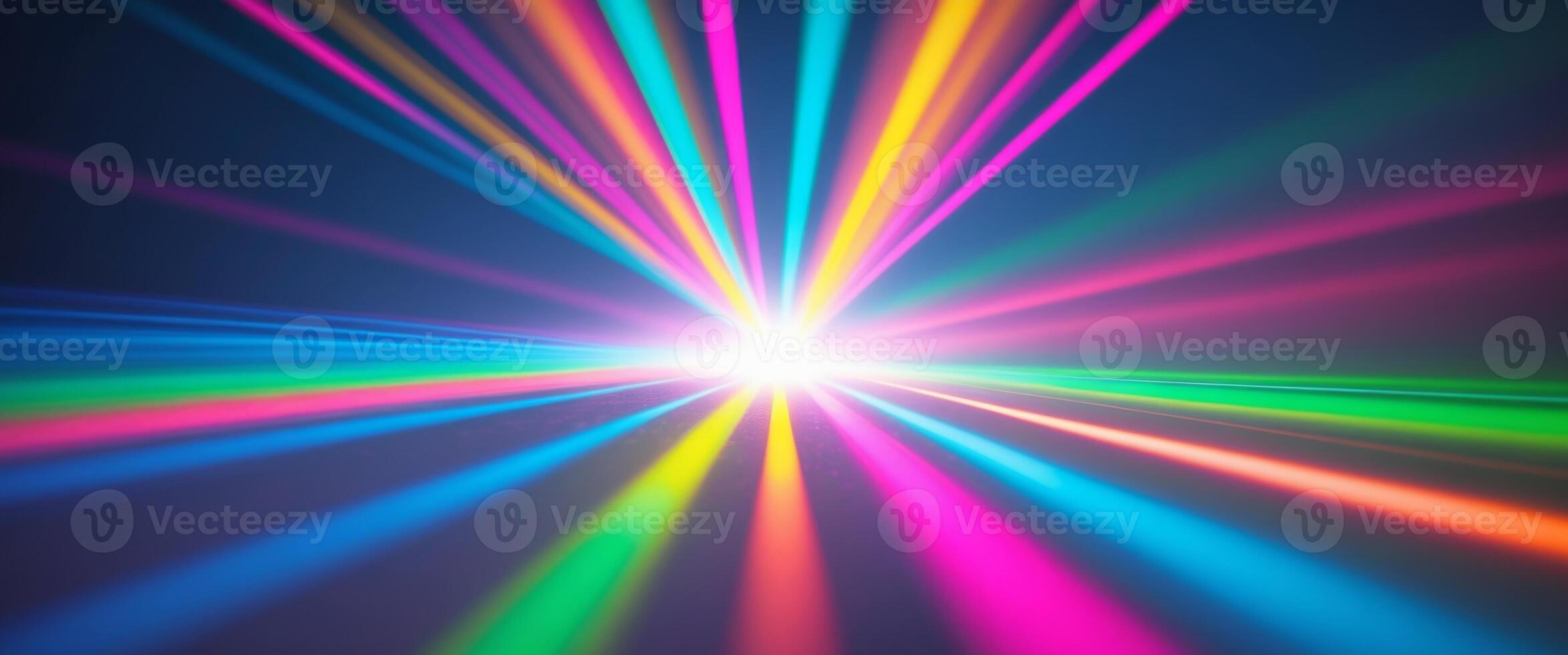 A rainbow colored light beam is shining in the dark photo