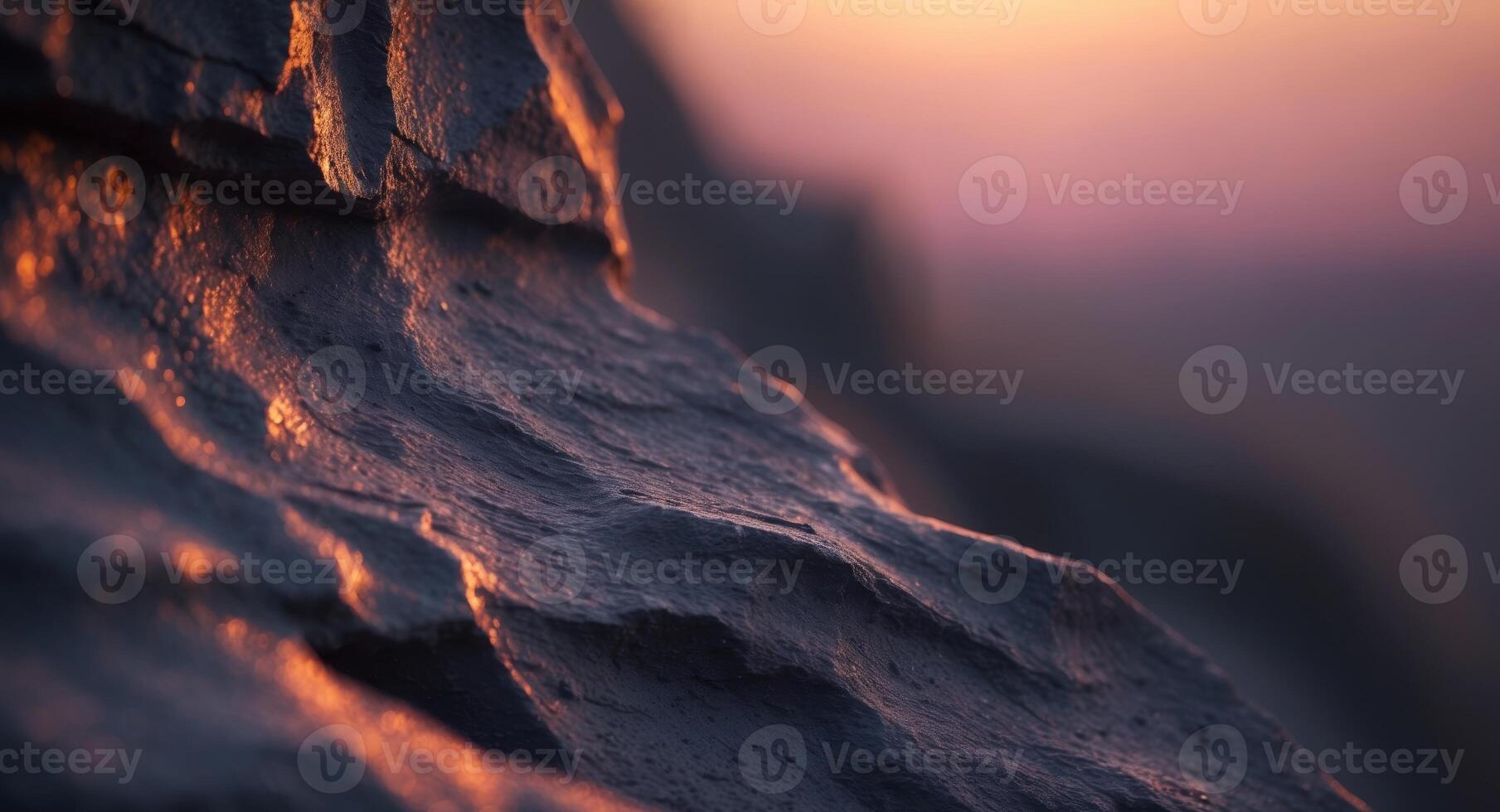 Sunset glow on dark rock wall texture background photo