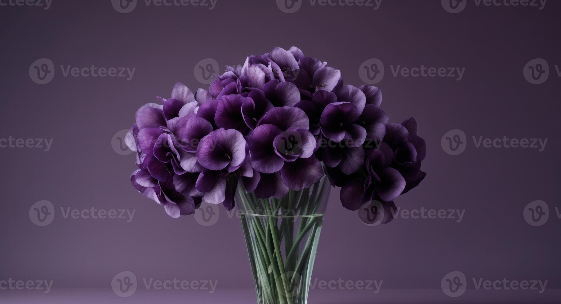 A bunch of purple flowers in a vase on a purple background. photo