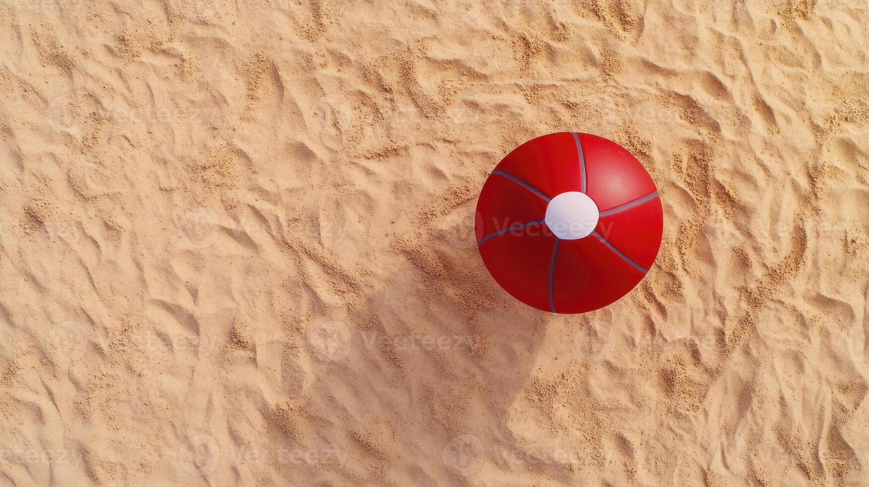 A red and white ball on the sand photo
