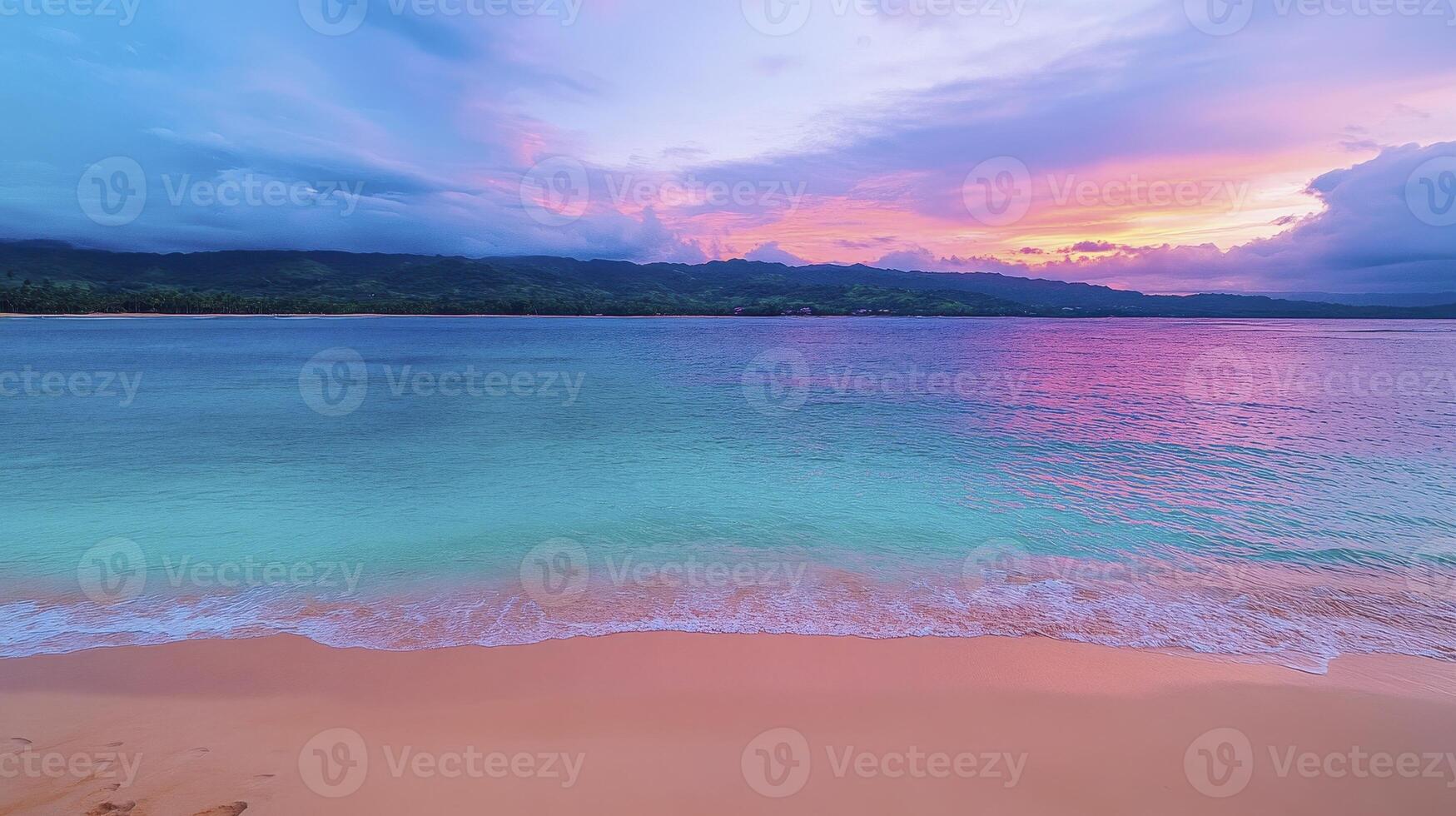 A colorful sunset over the ocean and beach photo