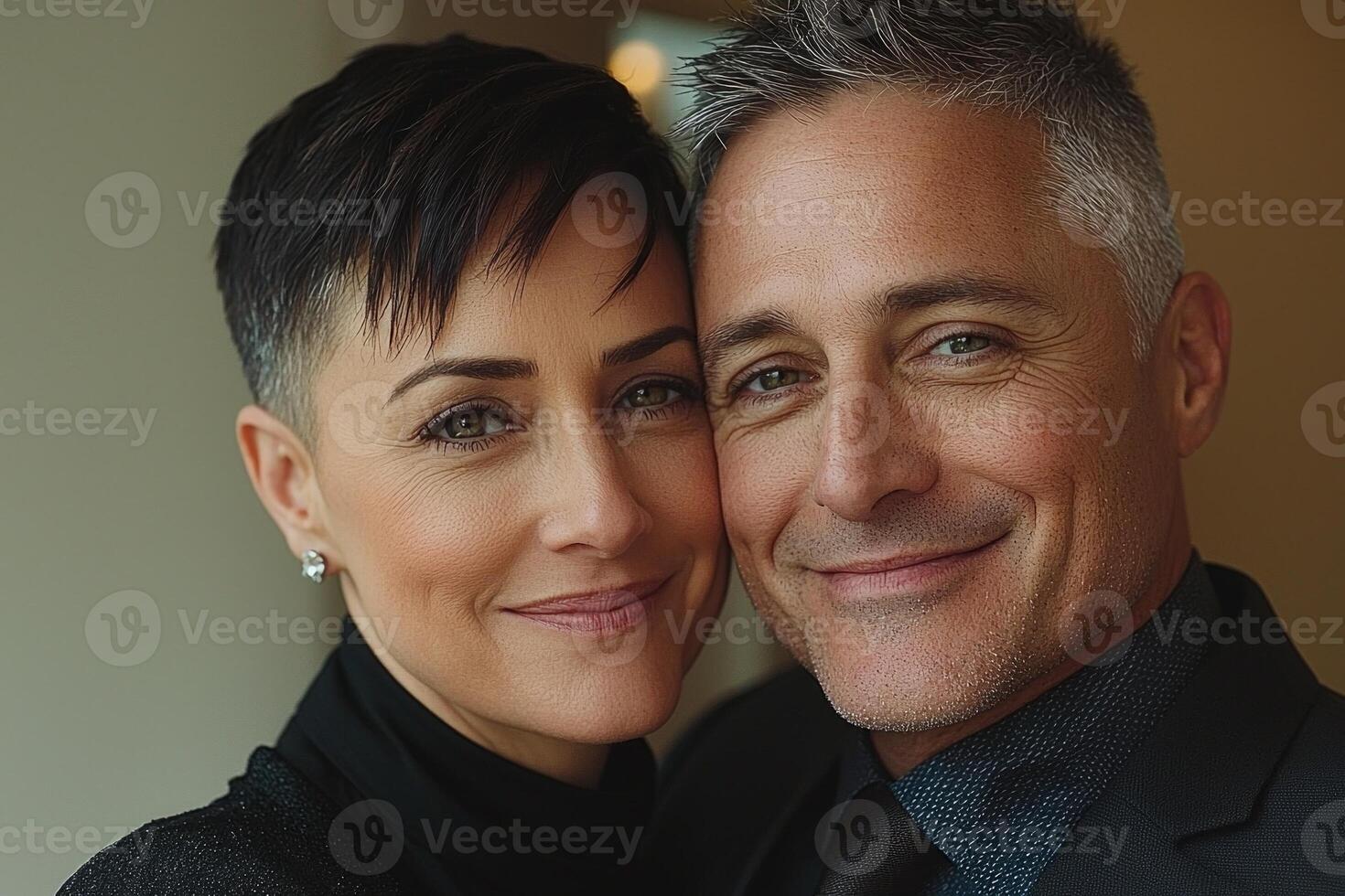 Within softly lit space middle aged transgender couple enjoys tender moment while one partner adjusts other's tie in front of mirror showcasing their love and connection photo