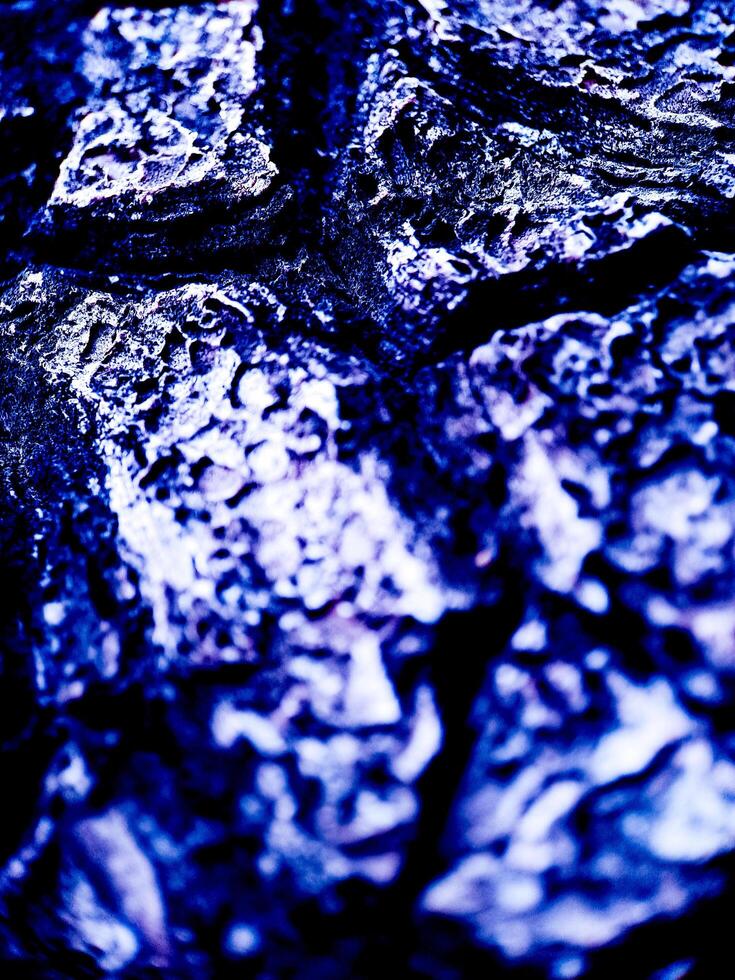 A close up of a rock with a black background photo