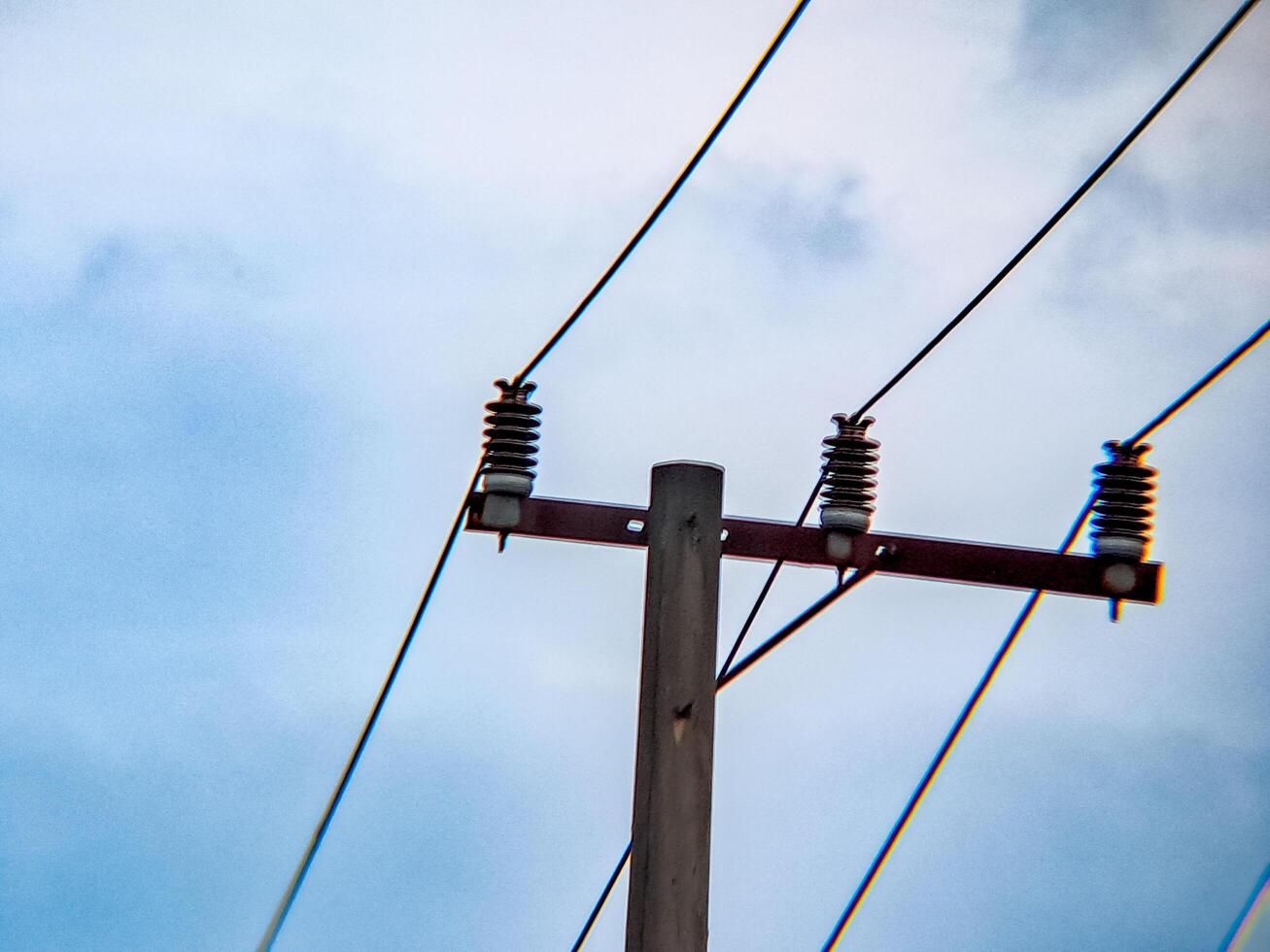 A large electrical pole with wires on it photo