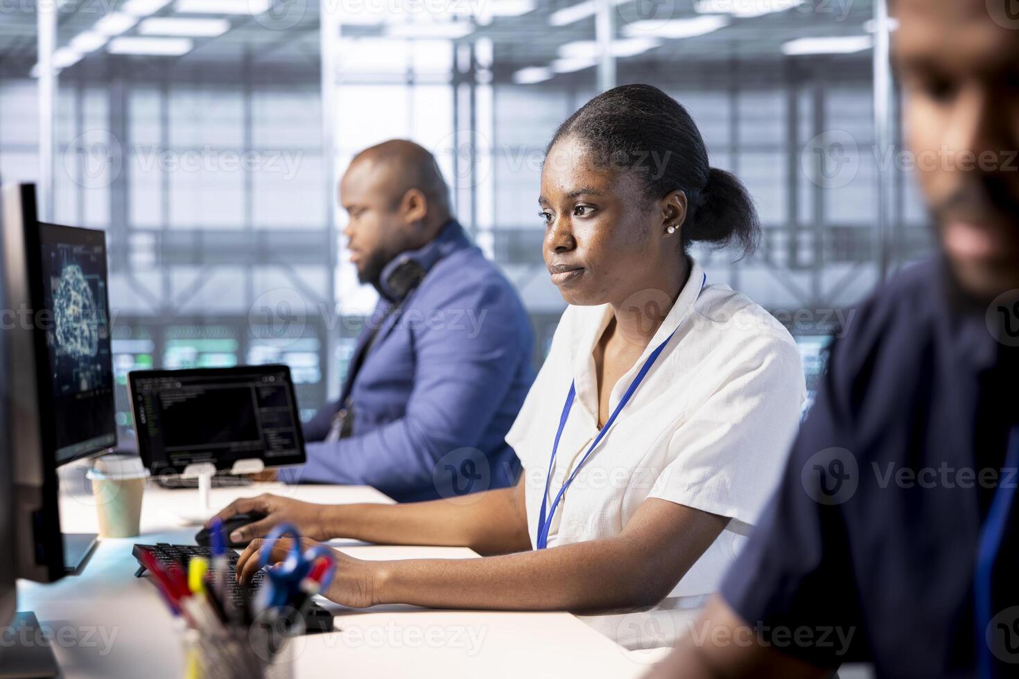 Data center engineers using programming languages to construct algorithms and build applications. Server hub workers designing and deploying software architectures, debugging and optimizing code photo