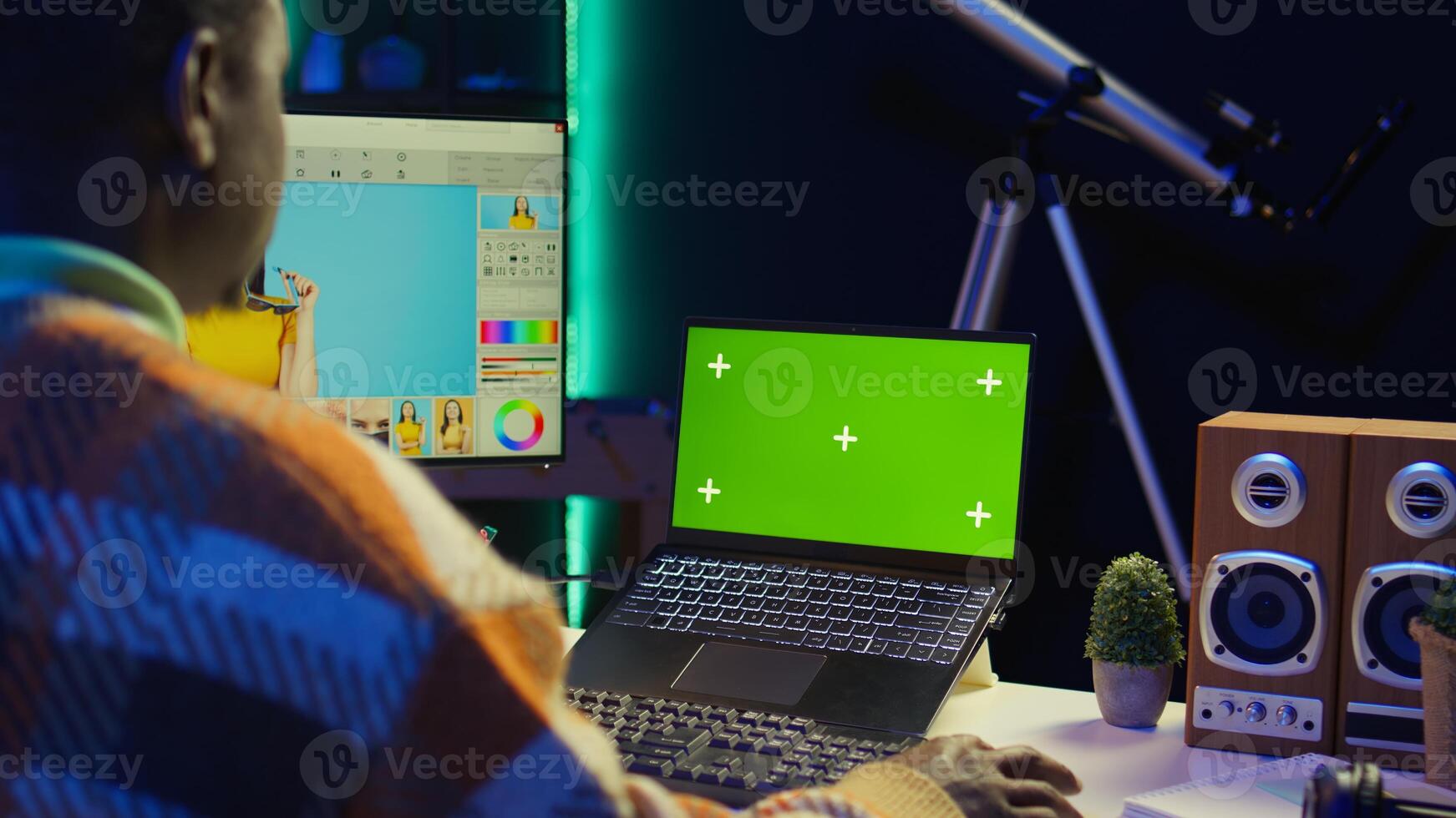 African american expert using AI neural network to develop a software with chroma key, cloud computing. IT programmer showing his dedication in cyber security, machine learning. Camera B. photo