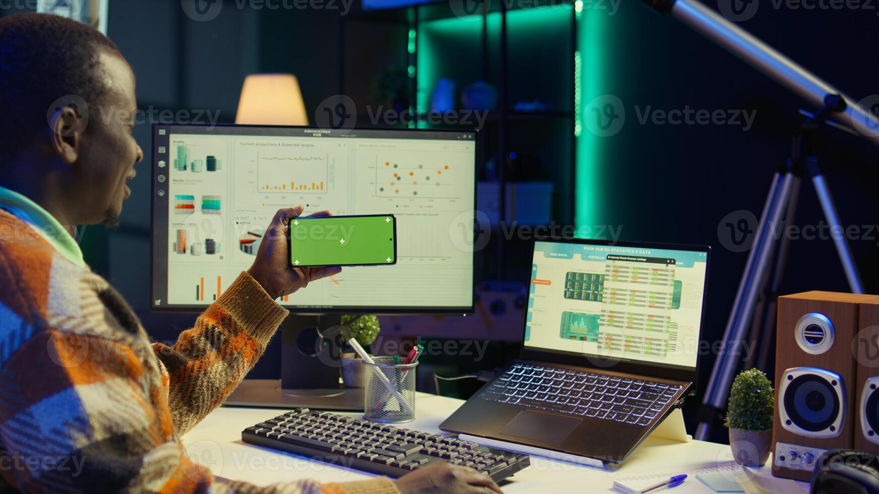 Expert analyst providing online evaluations of finances next to chroma key, solving accounting tasks for authorized balance analysis. Economist consultant estimates global earnings. Camera B. photo