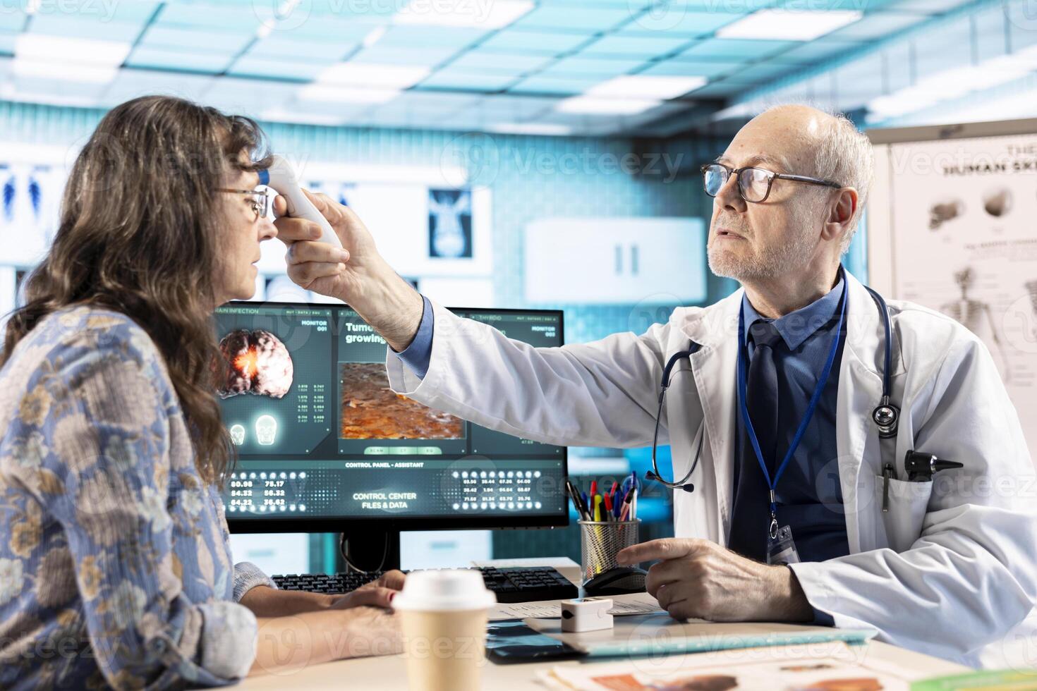 Medic expert uses a thermometer to find the right diagnostic and symptoms, working with modern tools to support healthcare industry on medical insurance services. Patient interaction. photo