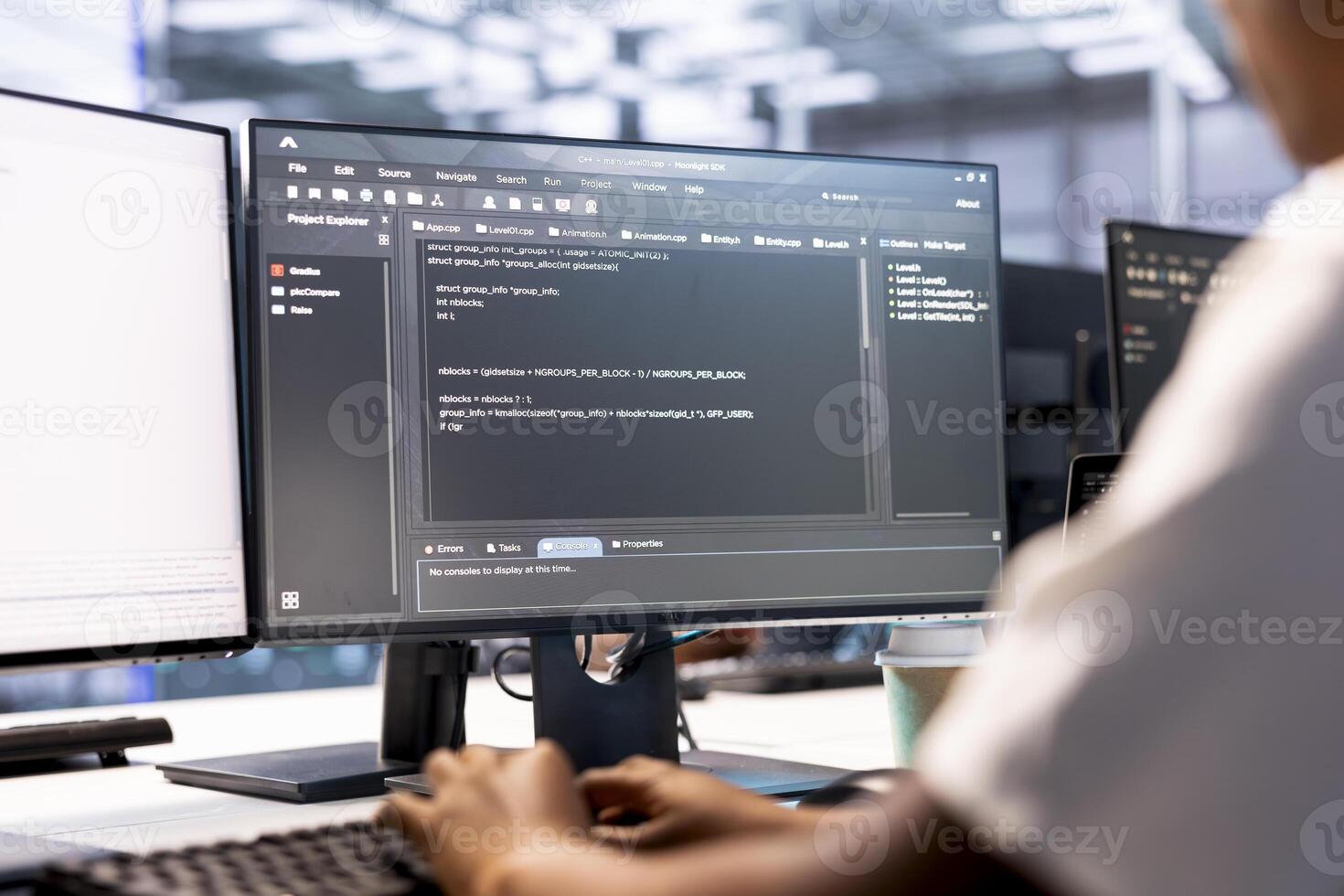 Developer in data center workspace using diagnostic tools and system monitoring software to identify root cause of errors. Woman working in server farm, mending equipment photo