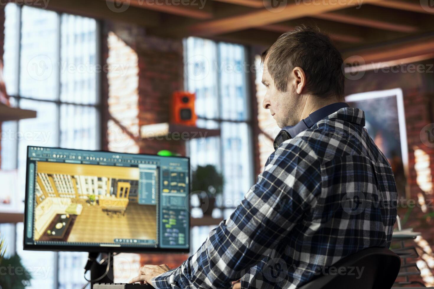 Interior designer operating 3D modeling application, importing furniture elements from library, placing them along floor grid. Architectural designer making floor plan in CAD software photo