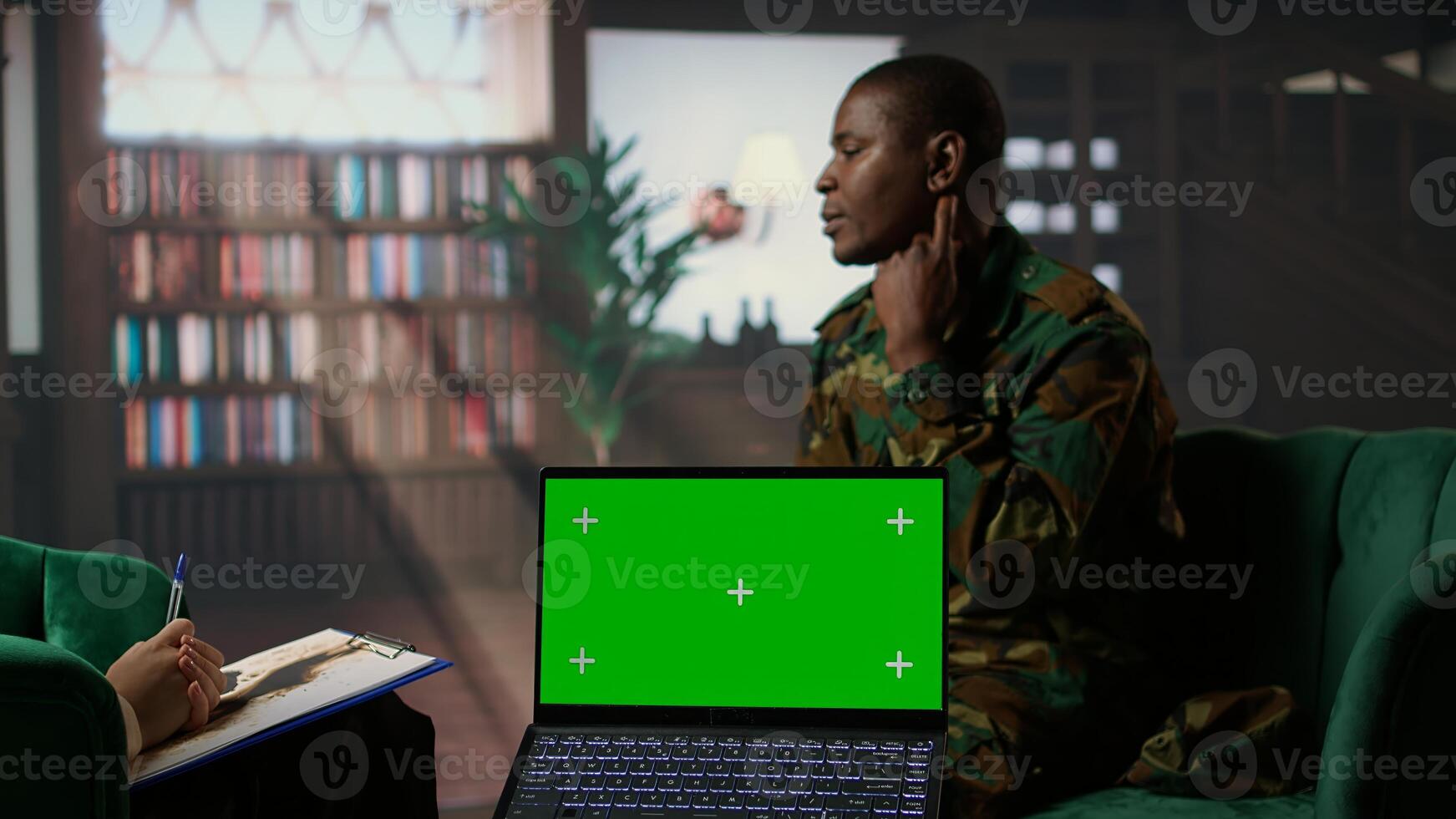 Army veteran at counseling shares war related anxiety next to isolated screen, discuss about psychological issues and infantry shell shock syndrome. Trooper listens to professional advice. Camera A. photo