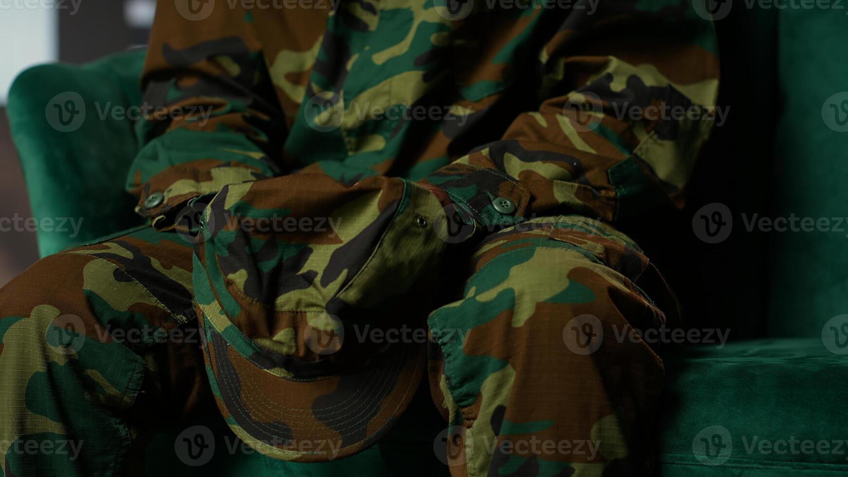 Armed forces trooper deals with depersonalization syndrome due to combat PTSD, feeling distressed and dissociative during therapy session. Black soldier with shell shock and trauma. Camera B. photo