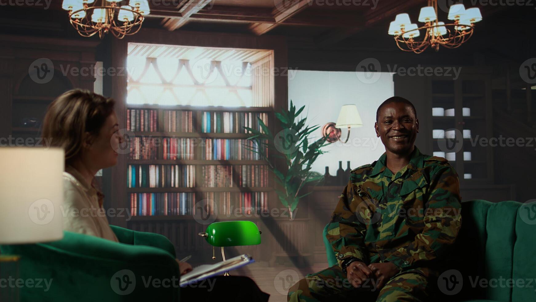 Portrait of army trooper meeting with a counselor to discuss about anxiety and distress due to PTSD and battle trauma, shell shock and mental disorder. Depressed trooper at counseling. Camera B. photo
