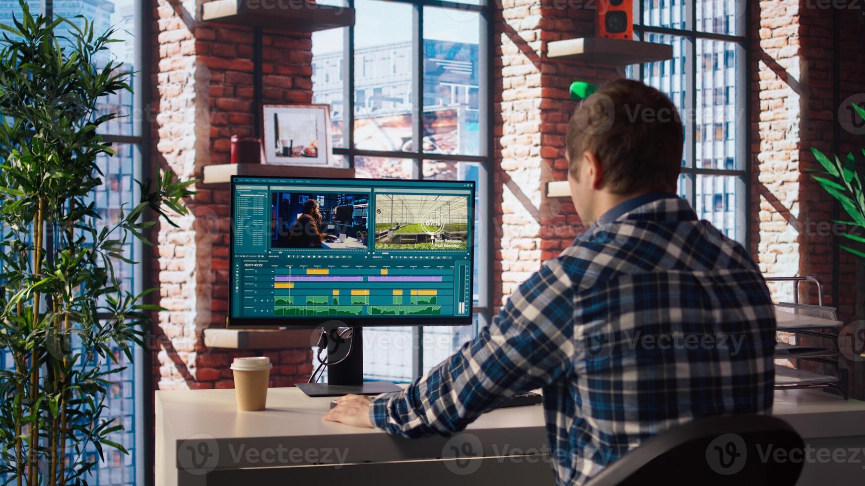 Remotely working videographer doing montage using specialized software applications. editor using editing tools on PC to cut movie project footage in home office, camera A photo