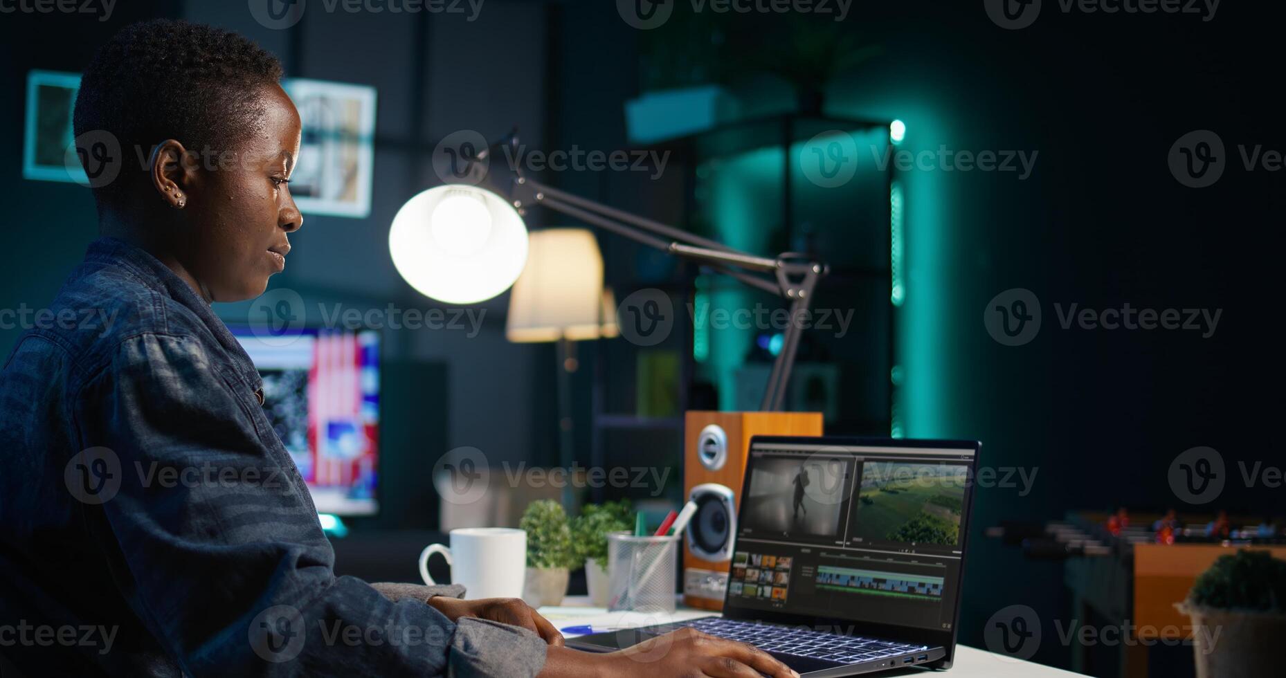 editor selecting key frames to use while doing montage, using specialized software applications. Freelancer using editing tools on computer to cut movie project footage in office, camera B photo