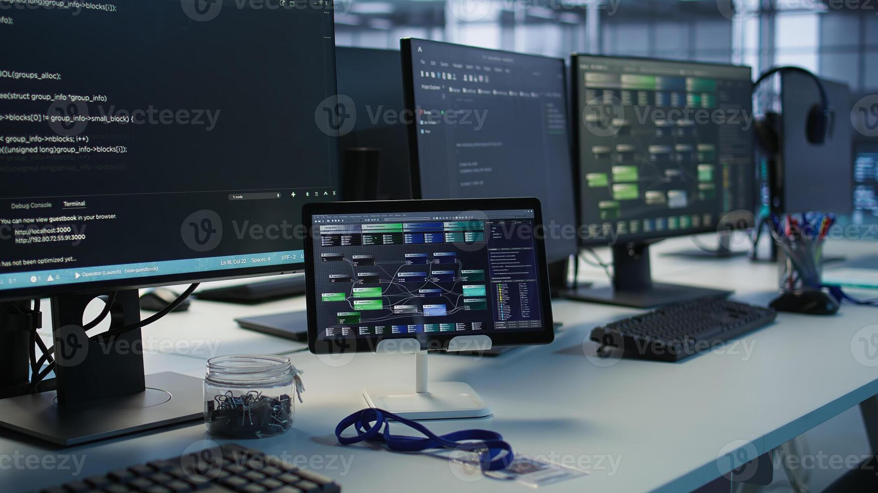 Close up of headphones left by worker on server room PCs used by employees working to ensure minimal downtime. Equipment in data center workplace used for monitoring performance photo