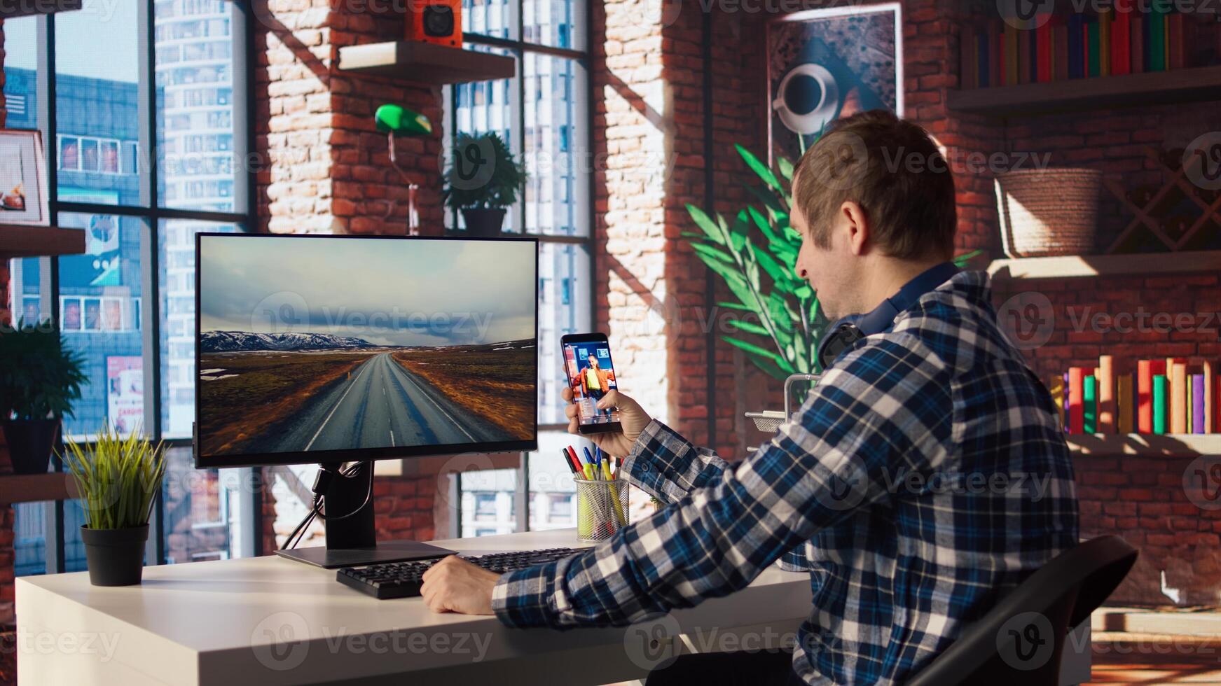Man at home watching social media live broadcasts, interacting in chat with online content creators. Person holding phone, using social network app to partake in livestreams, camera A photo