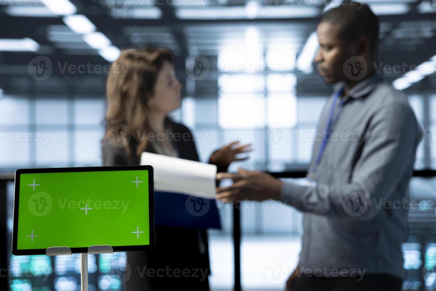 Mockup tablet used by data center technicians in blurry background reviewing hardware diagnostics. Close up of isolated screen device used by employees adjusting device configurations photo