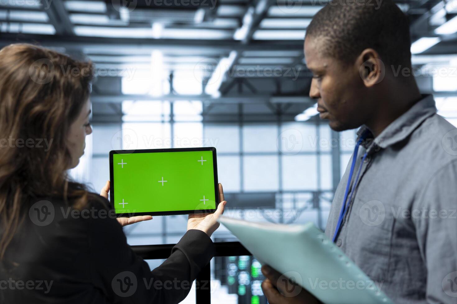 Mockup tablet used by data center coworkers reviewing rackmounts gear diagnostics. Close up of chroma key device used by teamworking IT professionals doing brainstorming, in server hub photo