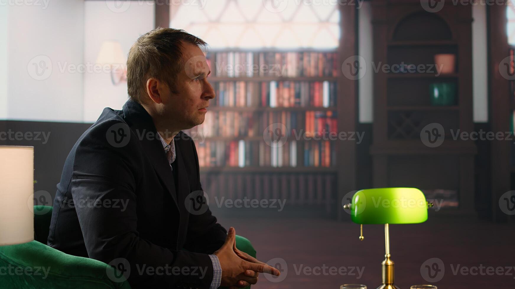Elegant classy professional enjoying a bourbon during meeting at a dandy club with a friend, focusing on collaboration and doubling their fortunes. Upper class negotiations between heirs. Camera A. photo