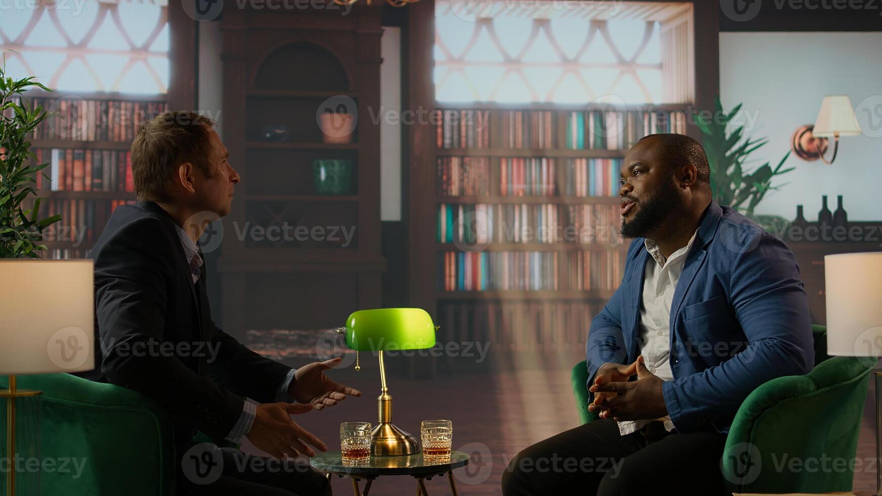 Billionaires engaged in an intense discussion sipping scotch in an upper class social club, exemplifying partnership and strategic decision making. Old money gentlemen negotiating. Camera A. photo