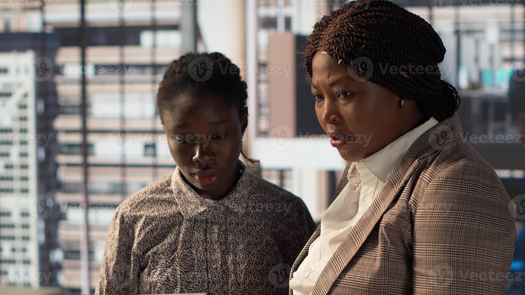 African American team collaborates on a financial planning project in a corporate office, emphasizing teamwork and data analysis to make informed decisions for future firm growth. Camera A. photo