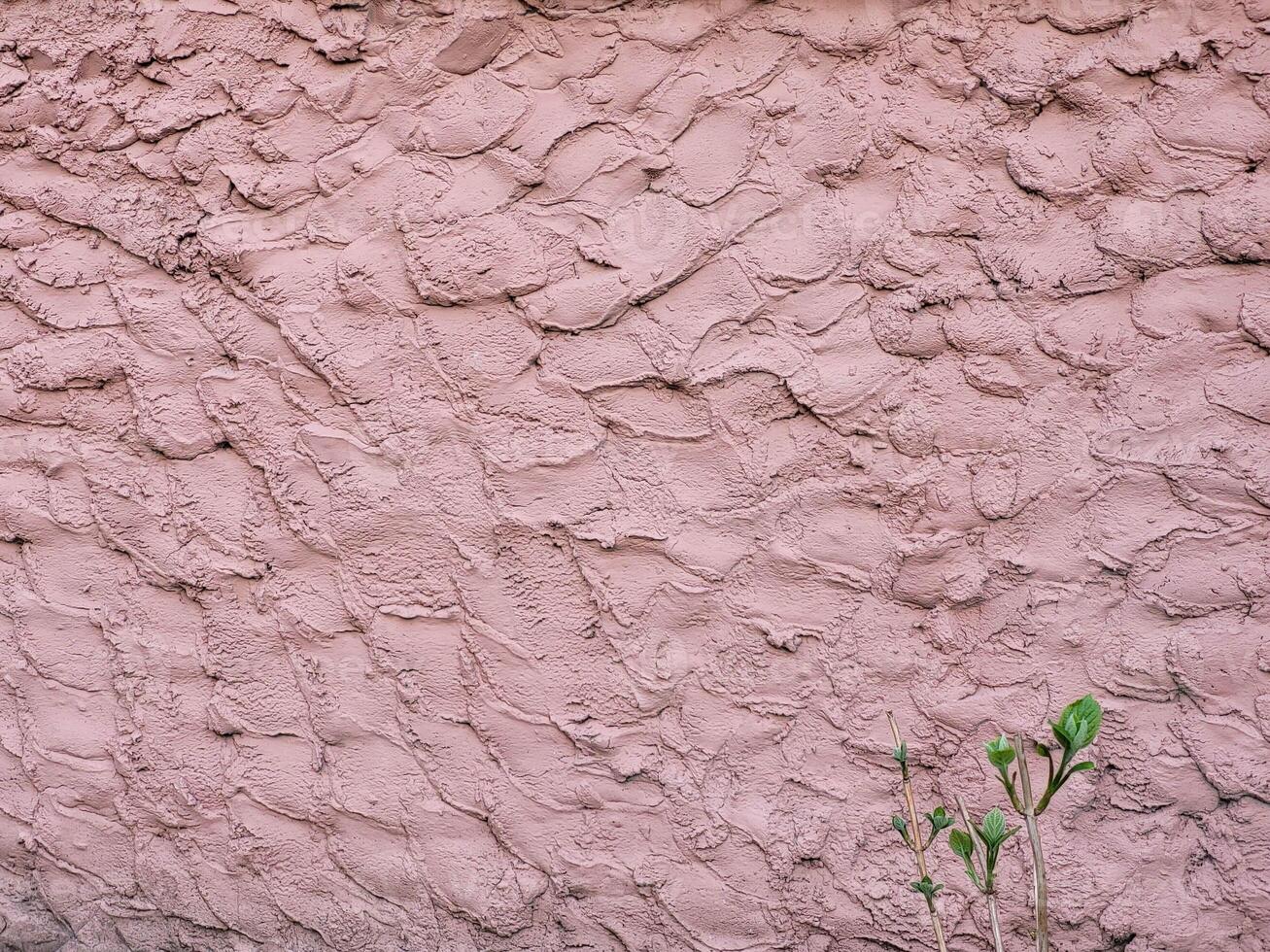 Beautiful pink background of decorative plaster fur coat photo