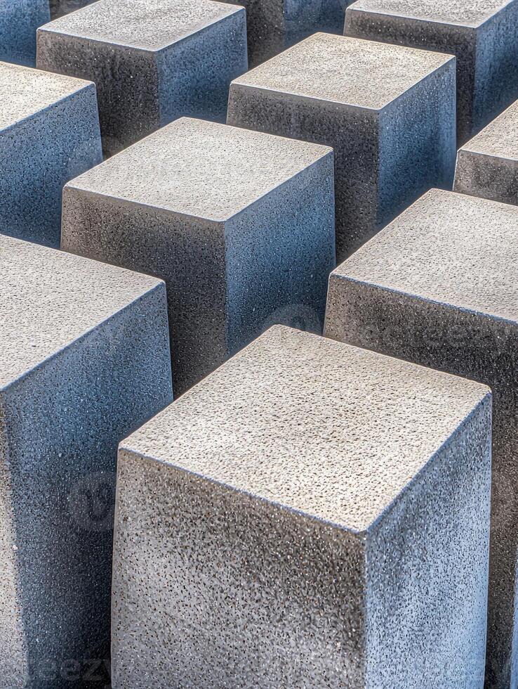 Grey Concrete Cubes Arranged In A Pattern photo