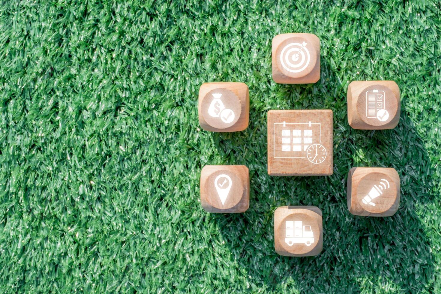 Wooden blocks on grass illustrating key elements of event management, including planning, organization, and coordination. photo