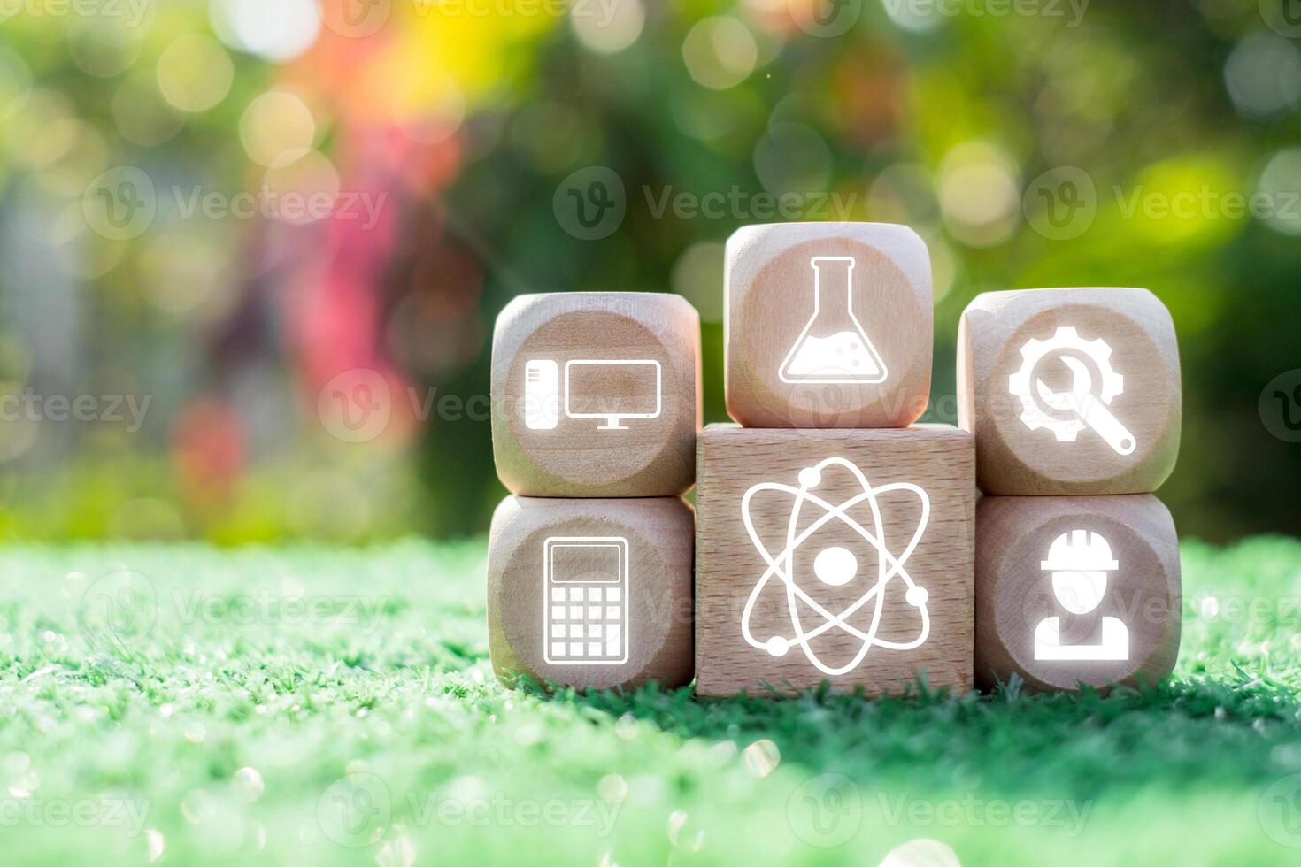 Creative representation of STEM education with icons for science, technology, engineering, and math on wooden blocks. photo