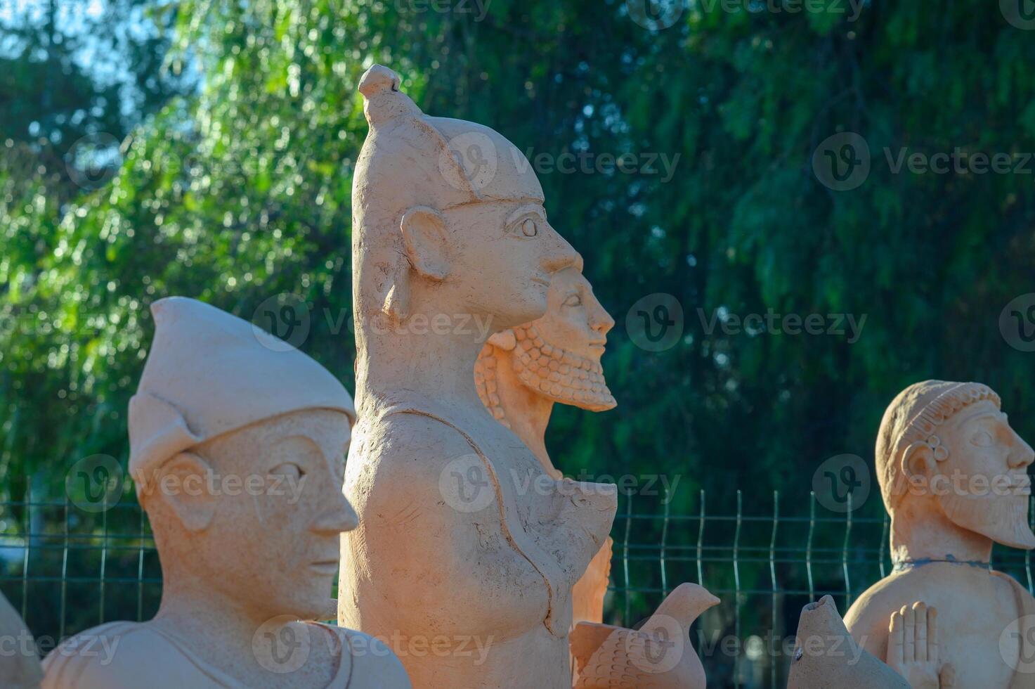 Exploring ancient sculptures at an open-air museum under the warm sun in the heart of a vibrant city photo