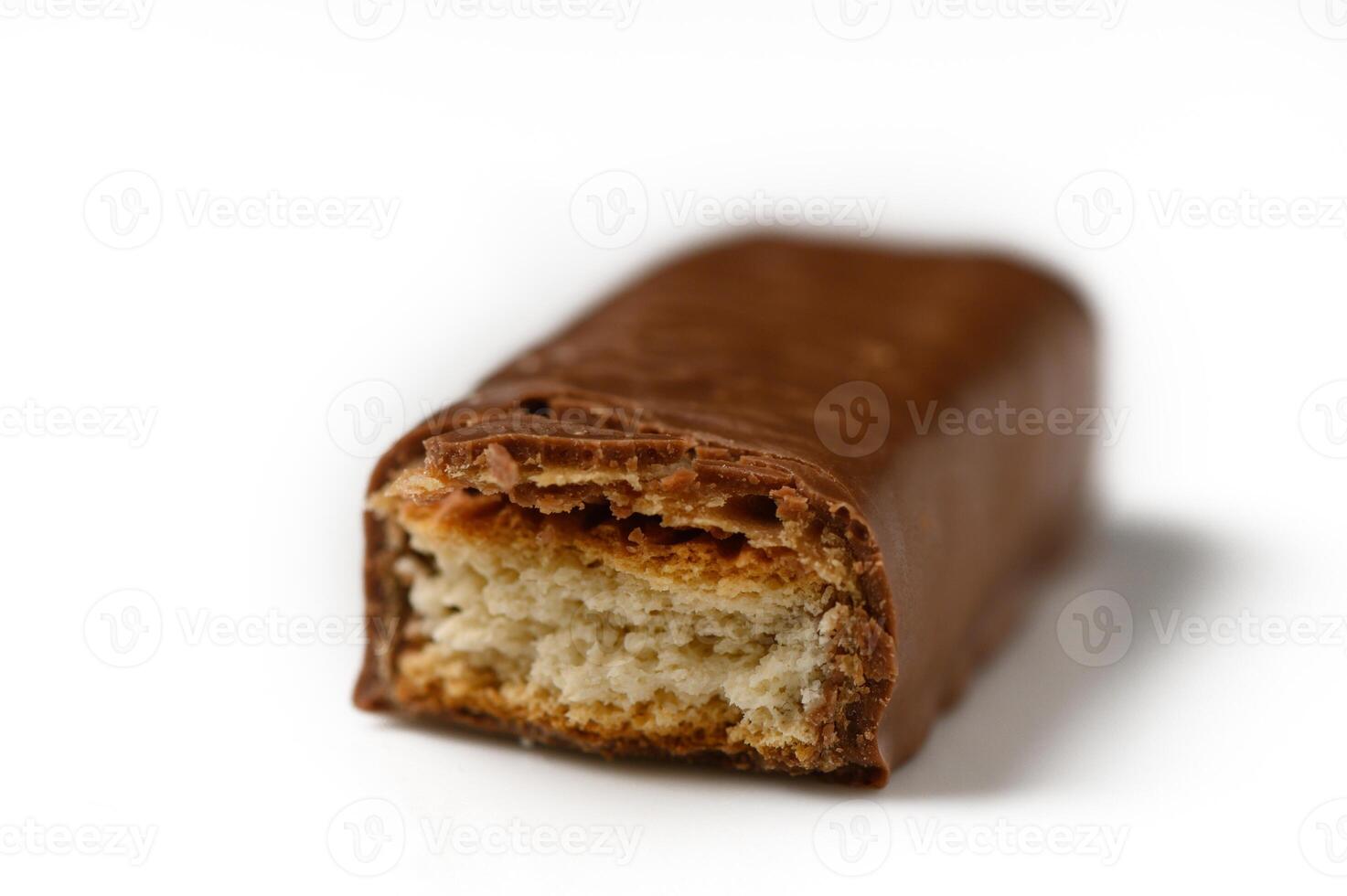 Decadent chocolate bar revealing layers of crispy goodness and creamy filling up close photo