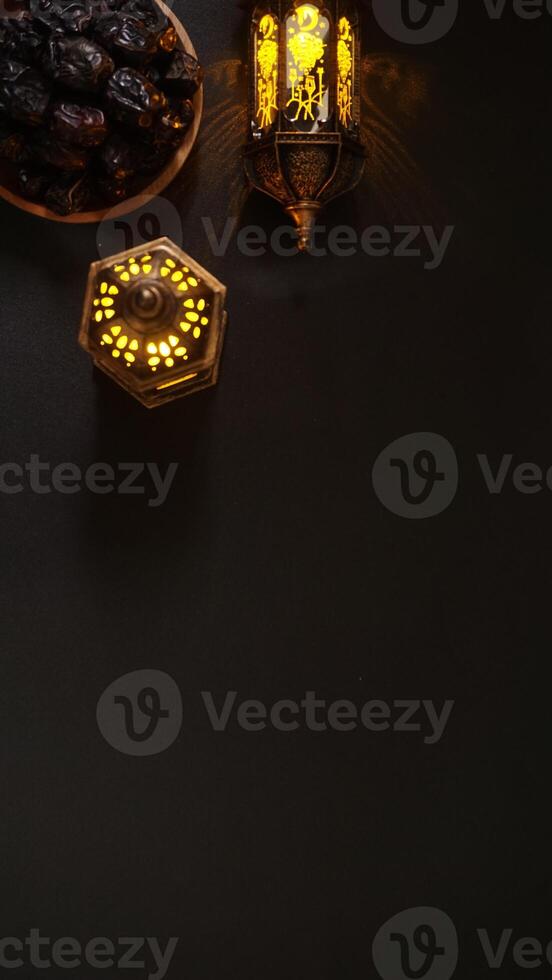 Ramadan Lantern With Glowing Candle and A Plate of Dates Fruit or Kurma photo