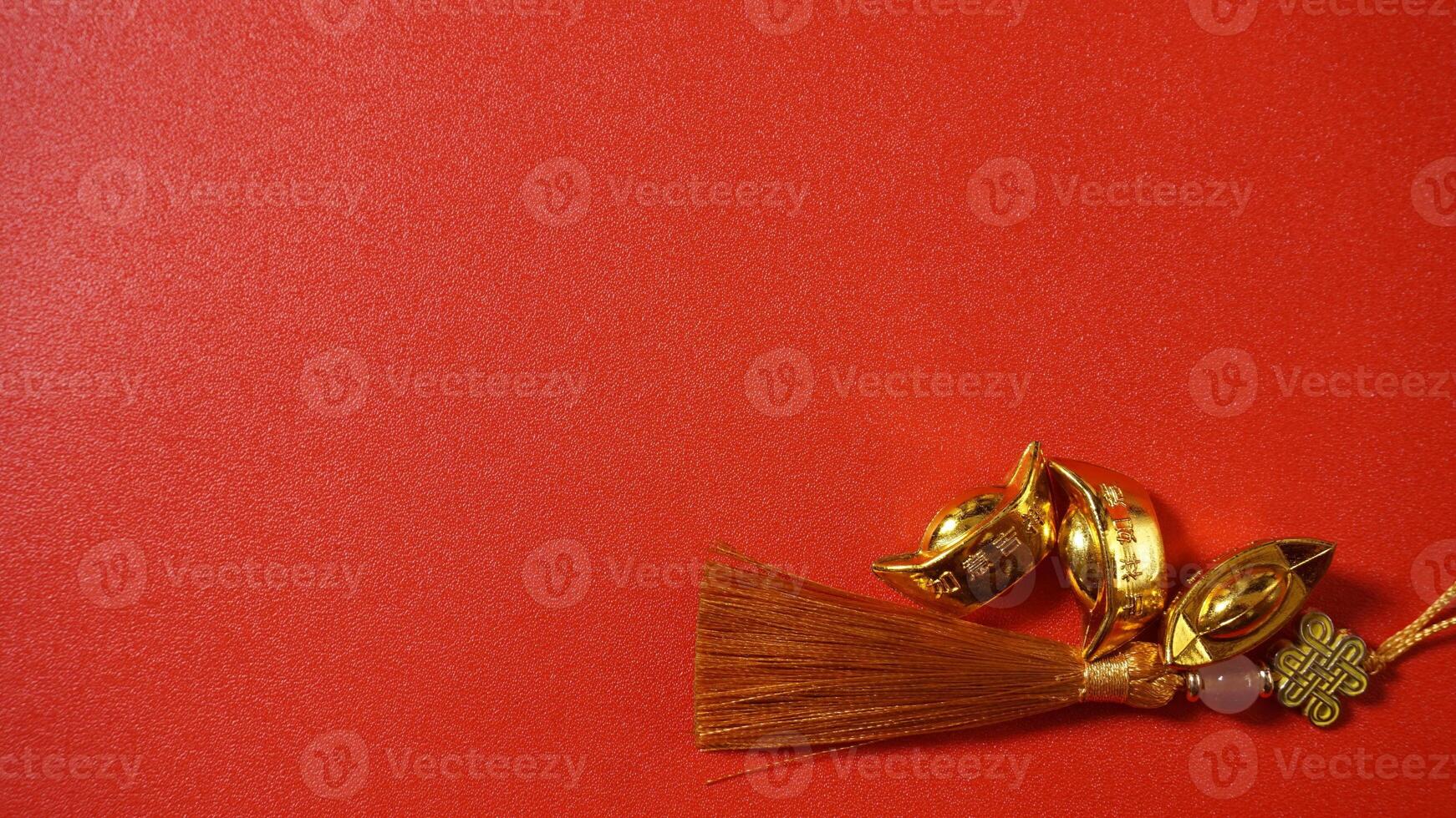 Lump of Chinese Gold Ingots and Chinese New Year Knot with Copy Space photo