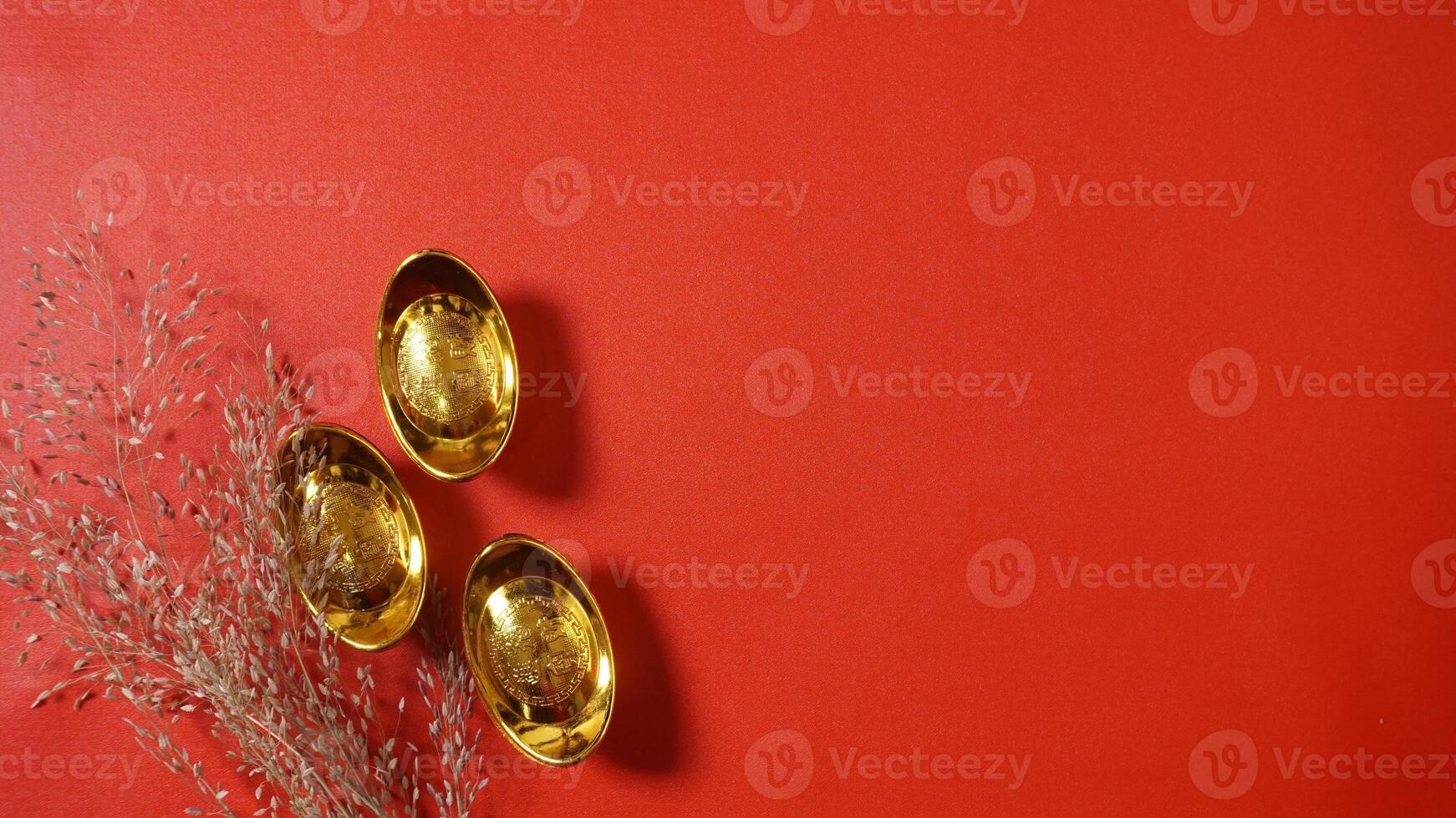 Chinese New Year Gold Ingots with Dry Plants Decoration photo