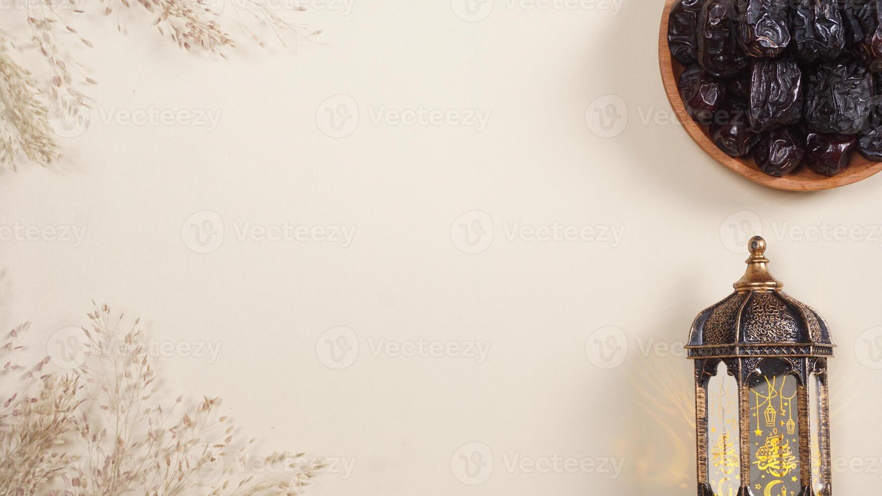 A Lantern and A Plate of Dates With Empty Space for Text photo