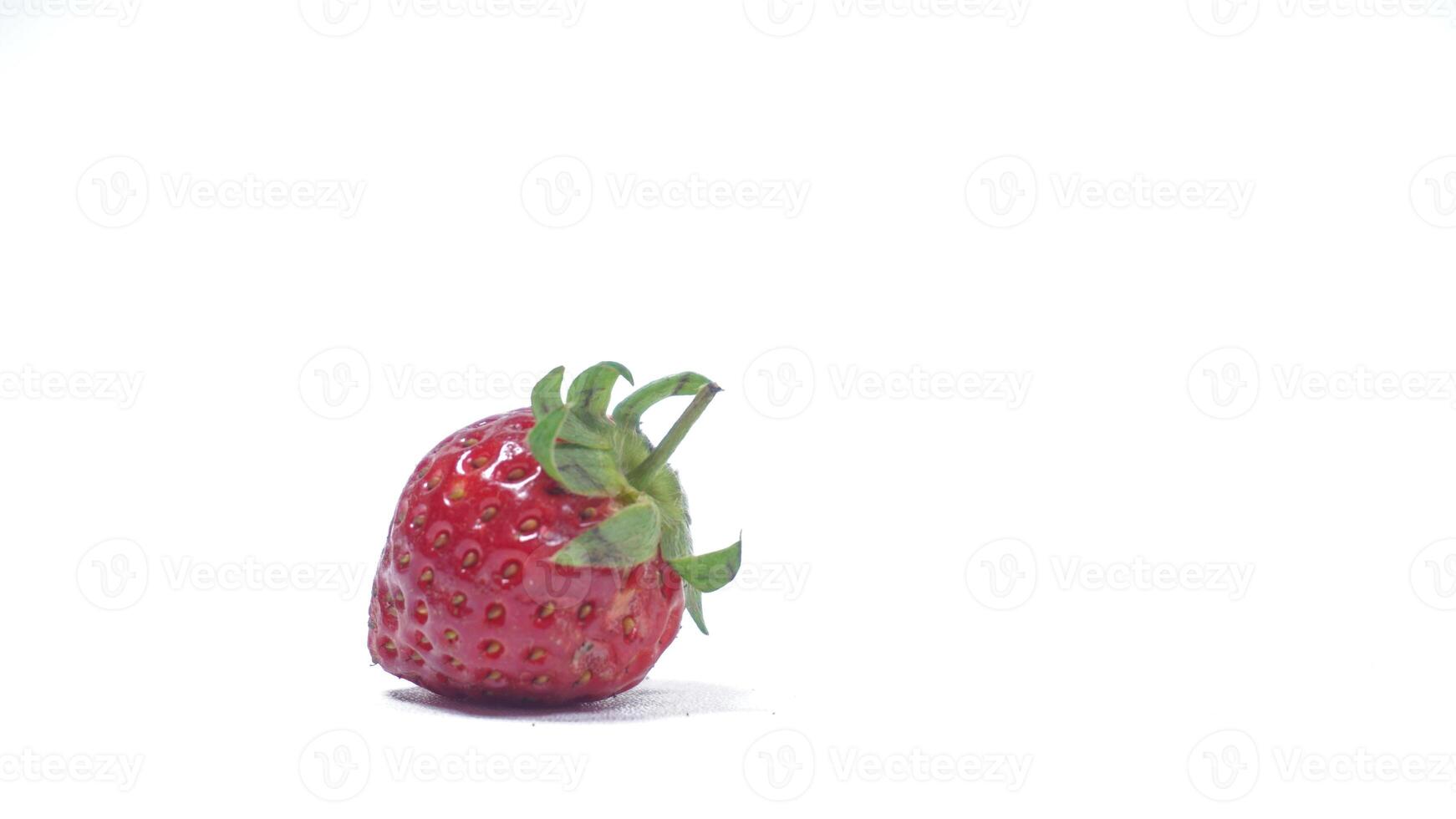 Single Strawberry Isolated on White Background photo