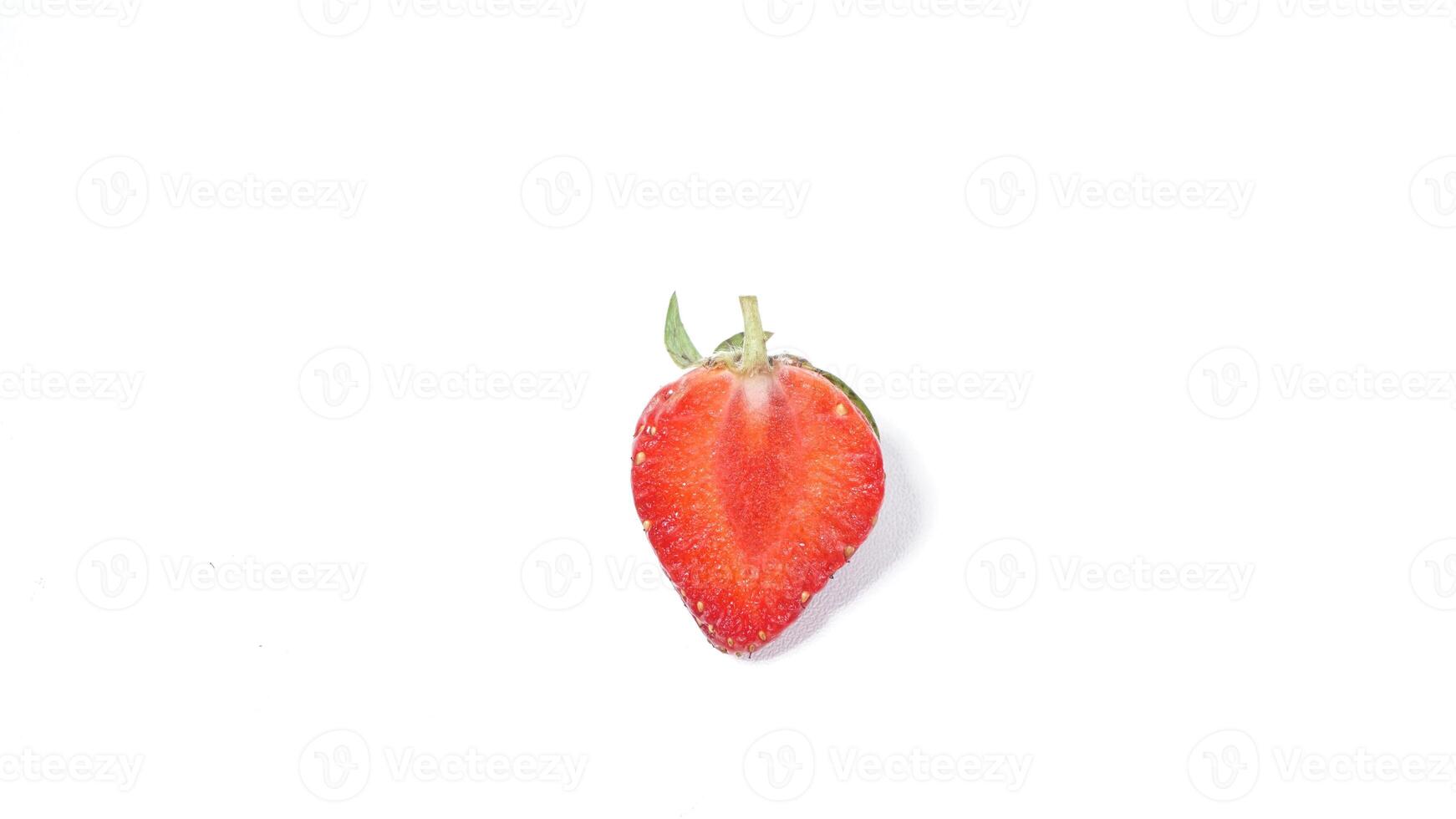 Half of Strawberry on White Background photo