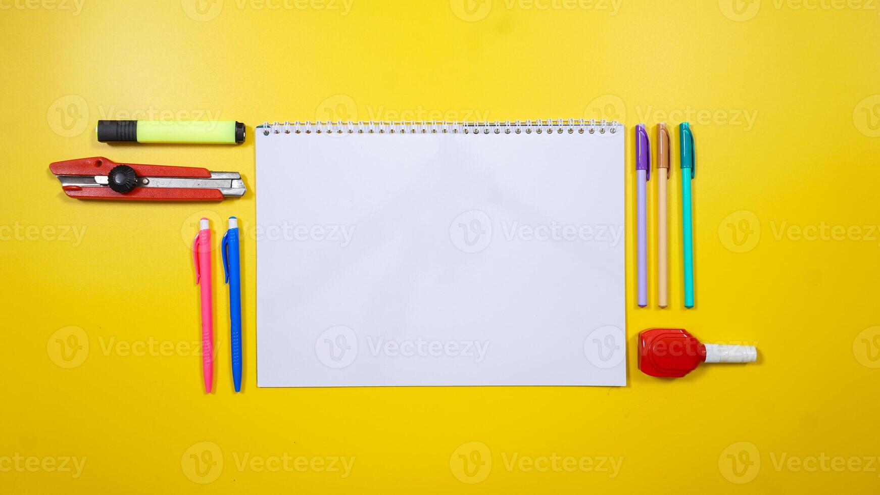 Blank Notebook for Copy Space with School Supplies Isolated on Yellow Background with Copy Space photo