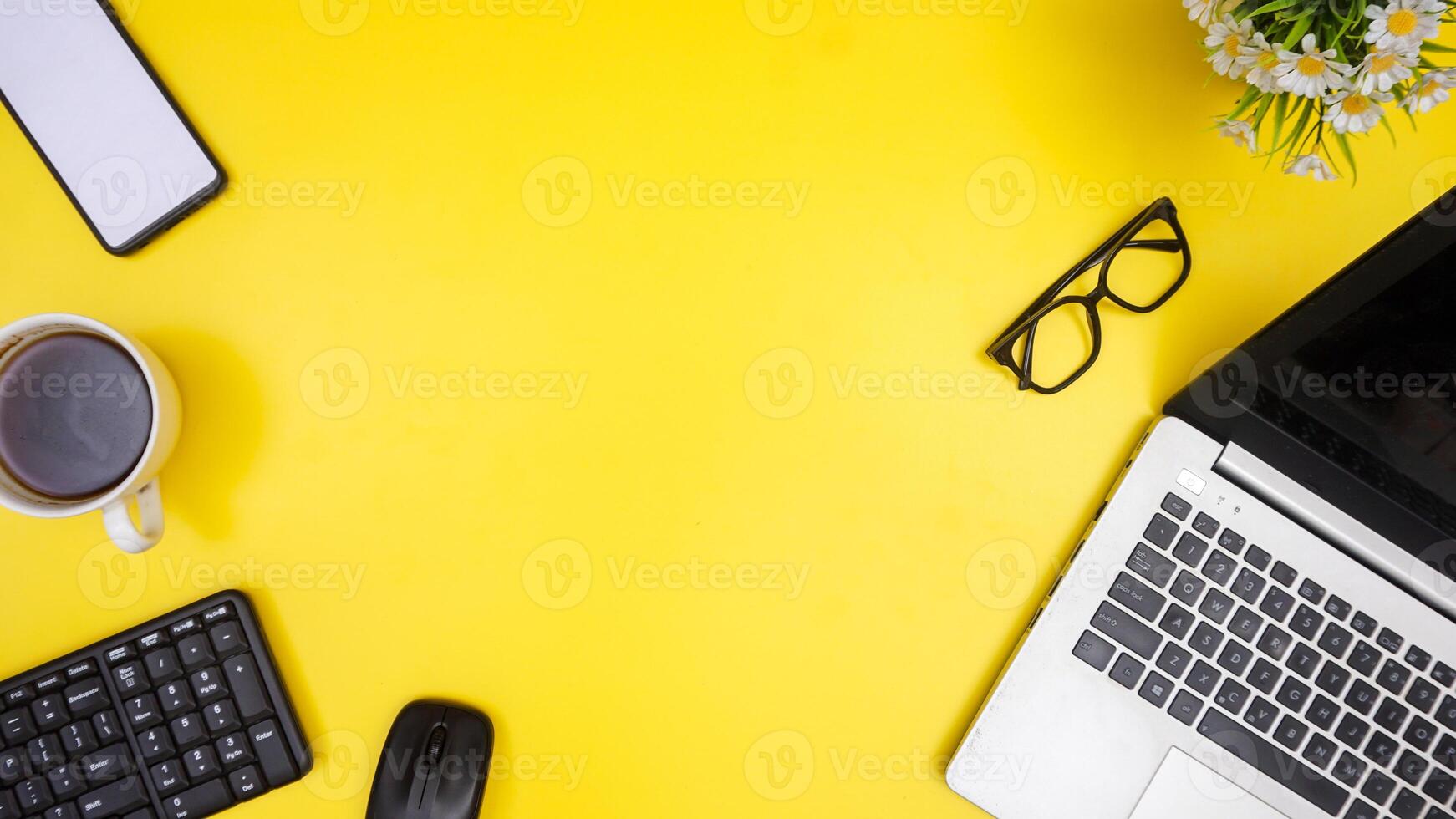 Top View of Copy Space with Working Stuffs on Yellow Background photo